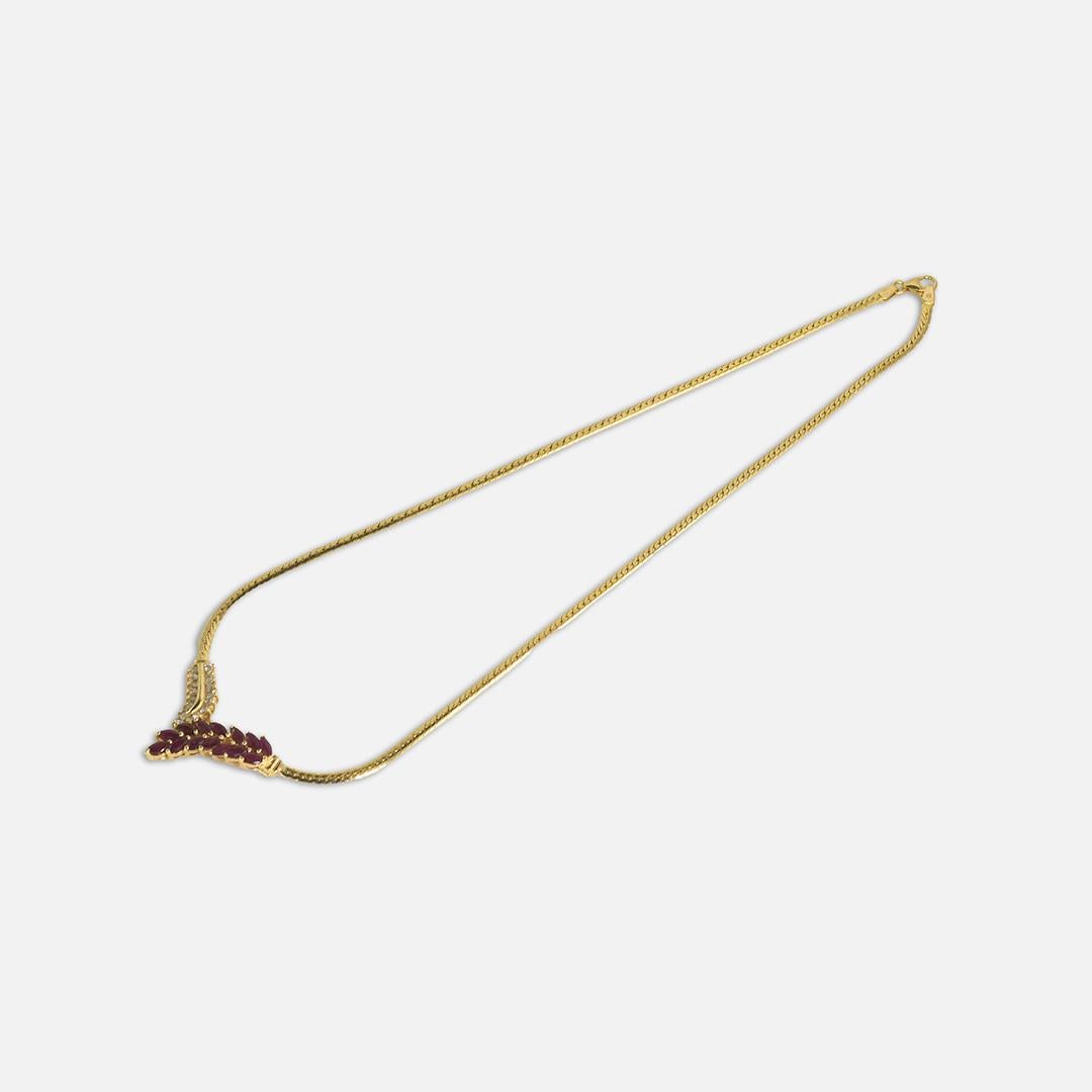 14k yellow gold Ruby and Diamond Necklace.
The rubies are marquise cuts, Diamonds are Round Brilliants. 1.50TCW
Stamped 14k, tests 57% on x-ray gun.
weighs 12.8gr, 17in long.
