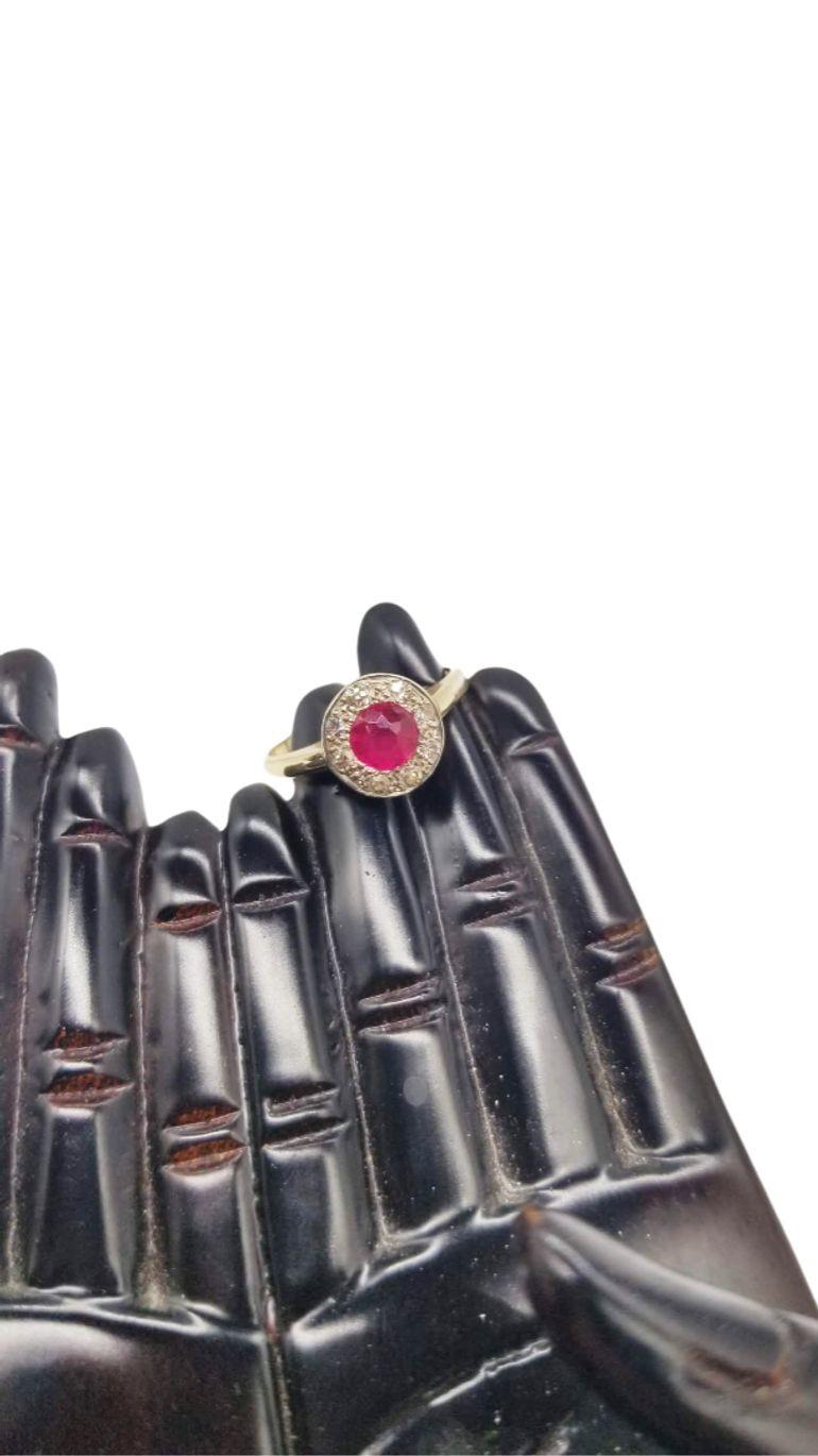 A timeless treasure, this vintage mid-century ring exudes elegance with its 14K gold setting adorned by a mesmerizing ruby center and sparkling diamond accents. Size 7, its classic design harmoniously merges sophistication and nostalgia, a perfect