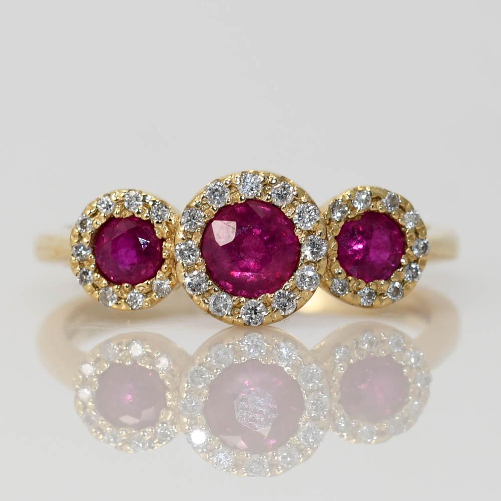14k Yellow Gold 3 stone Halo ring w/ Ruby and Diamonds.
The Natural Rubies are an intense pink color .60 total carat weight.
There is .15tdw. SI1-SI2 Clarity, G-H Color
Stamped and Tests 14k, weighs 3.2gr
Size 6 1/4, (Can be sized up or down 1 size