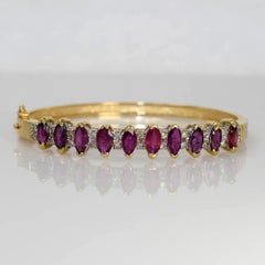 Bracciale in oro giallo 14K con rubini e diamanti, 17.8g, 3.00tcw