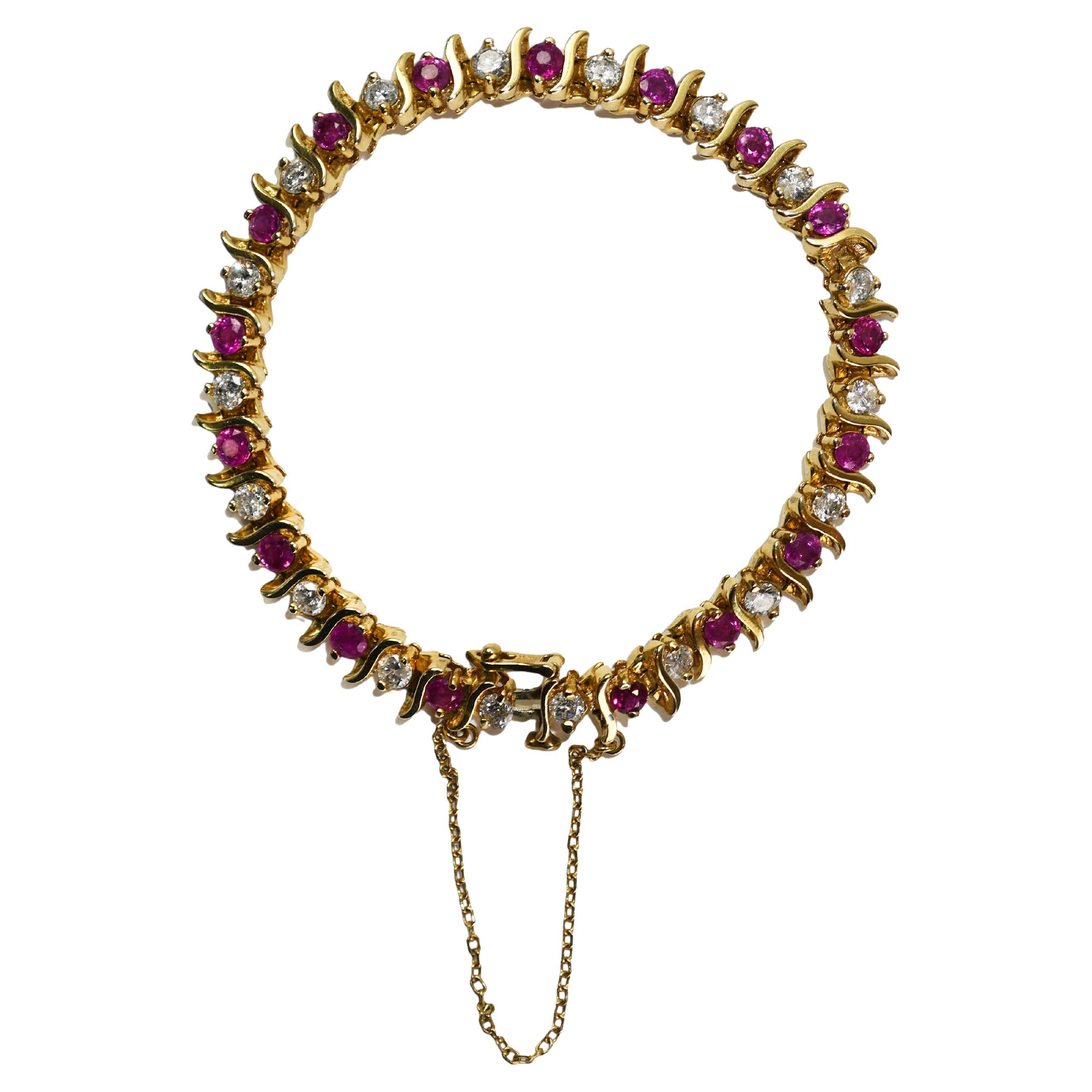 Tennisarmband aus 14 Karat Gelbgold mit Rubin und Diamanten