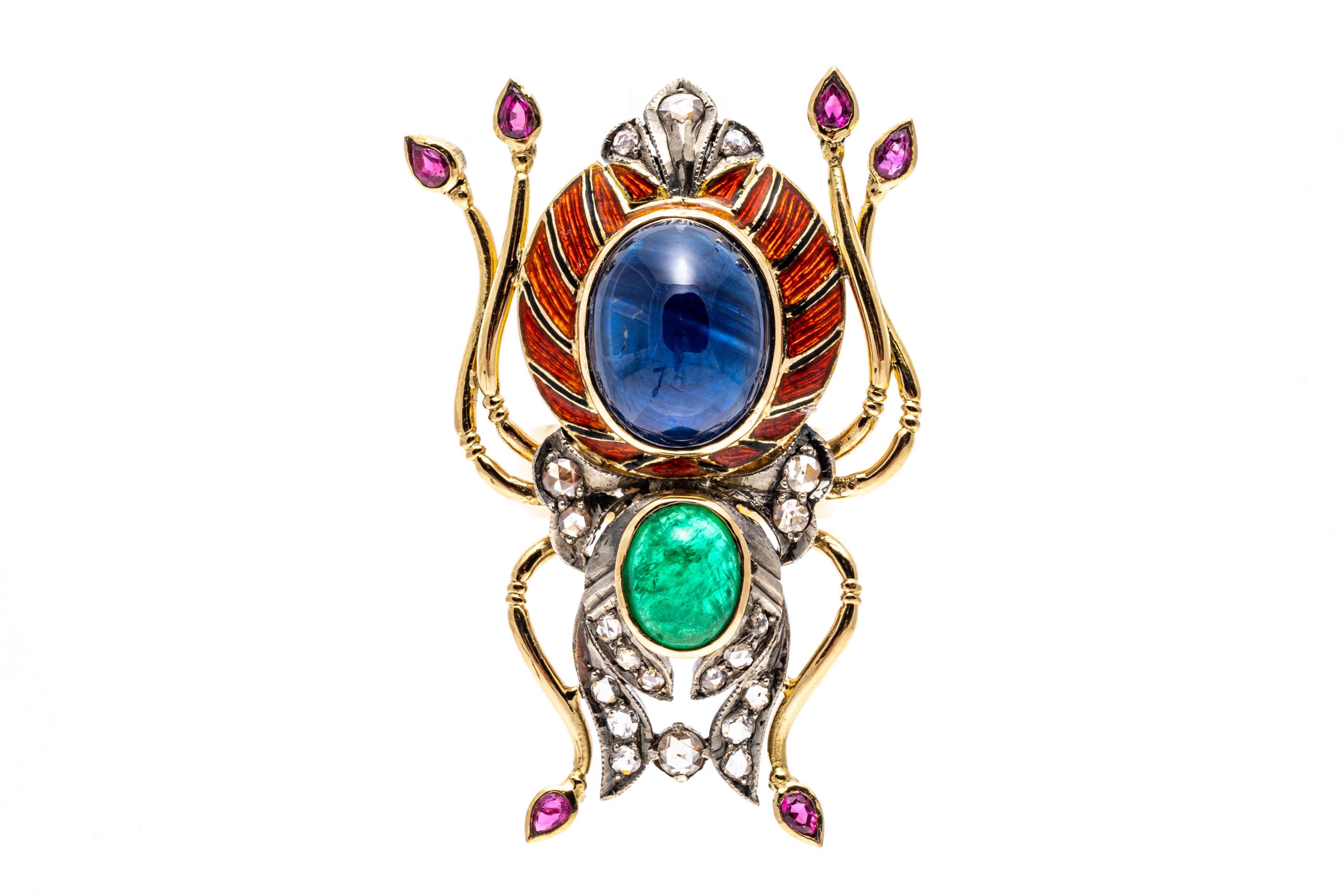 14k yellow gold and sterling silver ring. This imposing yellow gold ring is a large scarab style, with the body of the scarab set with an oval cabachon green emerald, bezel set, approximately 1.76 CTS and an oval cabachon medium to light blue