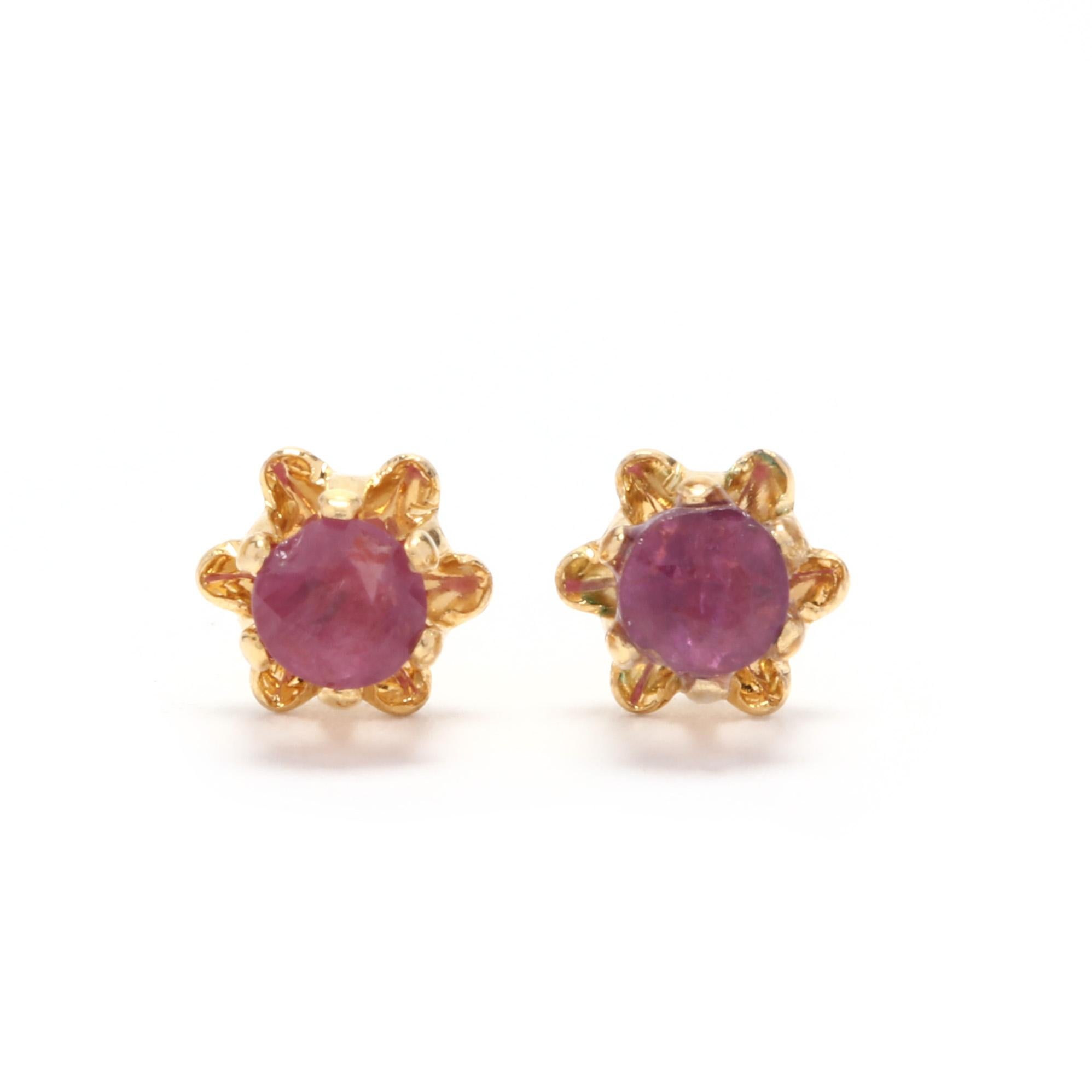 A pair of 14 karat yellow gold and ruby flower stud earrings. These earrings feature prong set, round cut rubies set in a tulip mounting and with push backs.

Stones:
- rubies
- round cut, 2 stones
- 3.25 mm
- approximately .40 total carats

.29