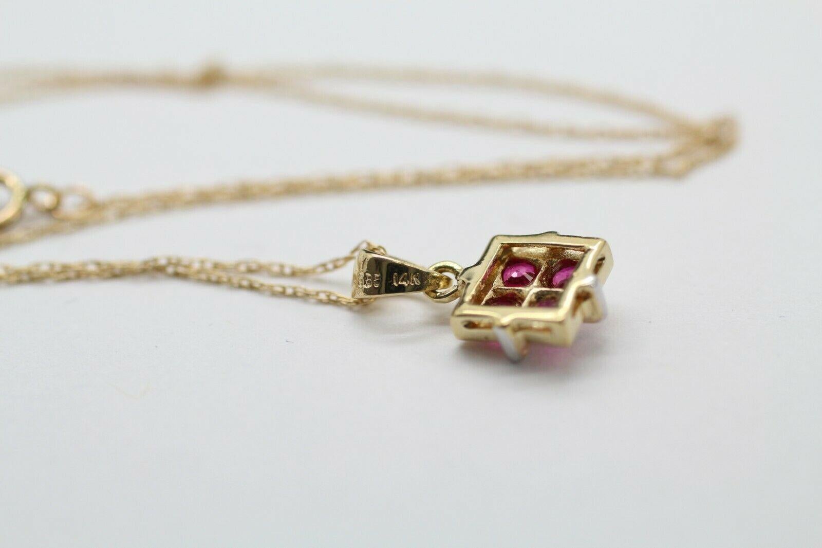  14k yellow gold ruby pendant, containing 
Specifications:
    PENDANT : RUBY BOX PENDANT 4 PIECES 
    CHAIN: LINK CHAIN
    LENGTH: 18.99-19.99 INCH
    weight: 2.15 GTW
    METAL : 14K YELLOW GOLD
    HALMARK: 14K' 585


