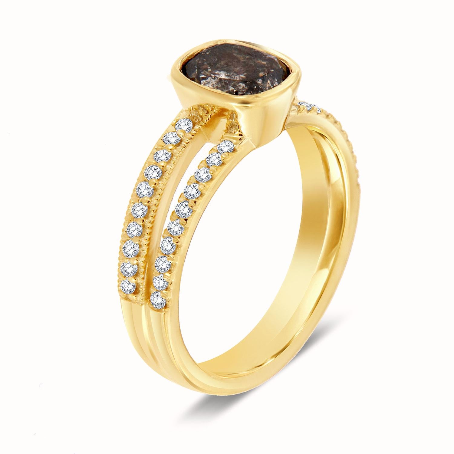 This Organically designed ring features forthy (40) round brilliant Micro-Prong set on two unevenly split shanks to create the perfect imbalance. A 1.42 Cushion Shaped Salt and Pepper diamond bezel set on top of the uneven shank. The light milgrain