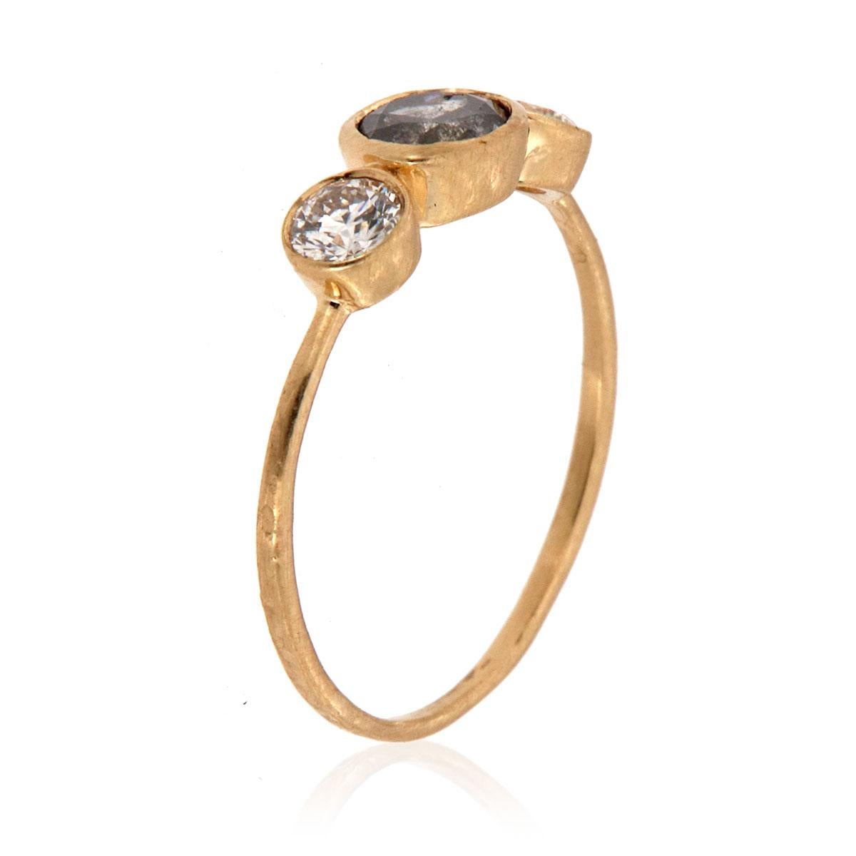 This delicately handcrafted, one-of-a-kind rustic, organically designed ring features a trilogy of three round diamonds. A 0.48 -carat Salt & Pepper center flanked by white round brilliant diamonds in a total of 0.33 carat. The 1.2 mm wide lightly