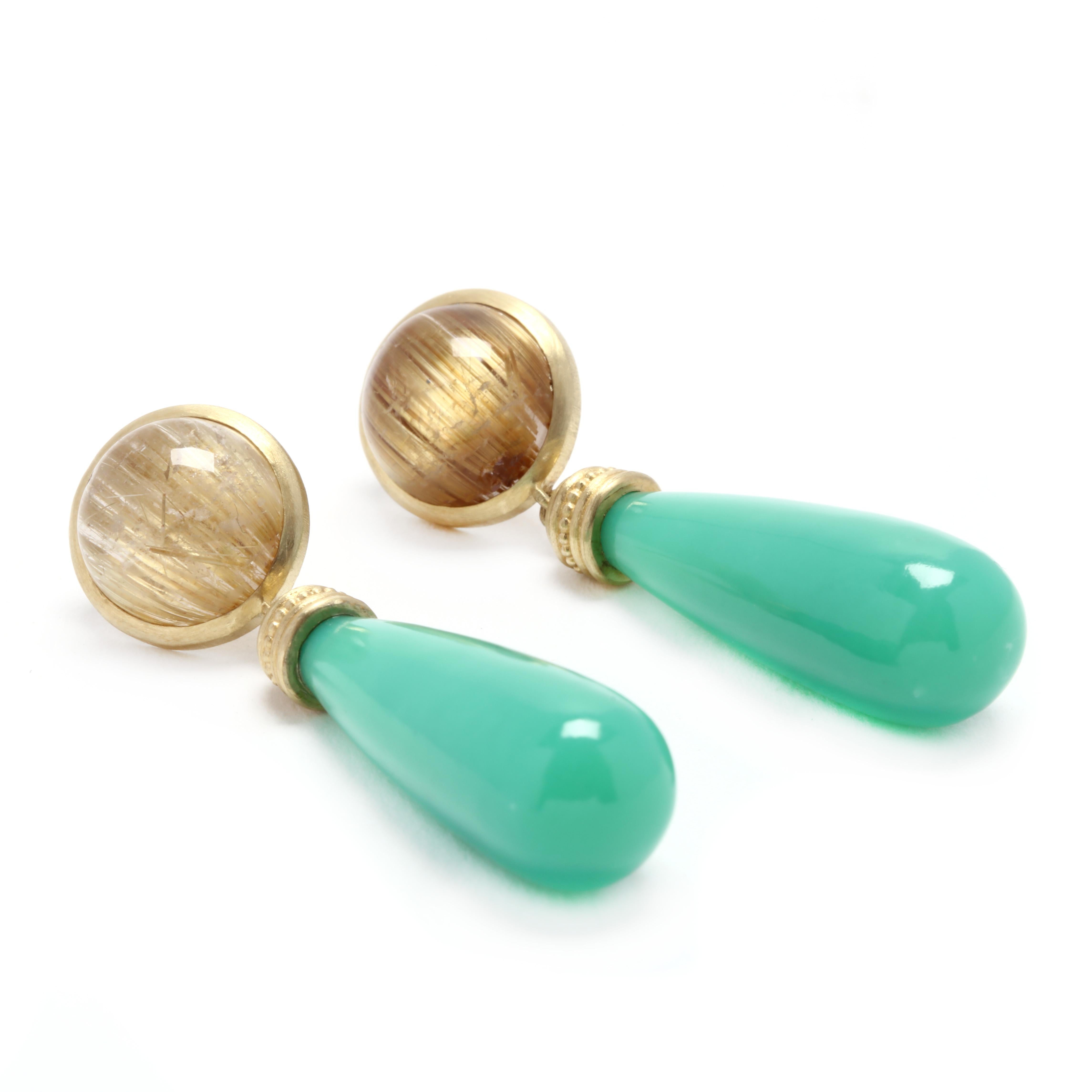 A pair of 14 karat yellow gold rutilated quartz and chrysoprase dangle earrings. These earrings feature round cabochon rutilated quartz studs, each with an oblong green chrsyoprase dangle and with pierced push backs.

Stones:
- rutilated quartz, 2