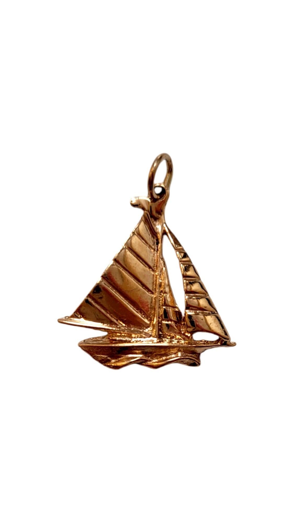 14K Yellow Gold Sailboat Charm-

This sailboat charm is perfect for adding a touch of seaside charm to any bracelet or necklace, it symbolizes freedom, exploration, and the open sea. Crafted with precision, it's a beautiful reminder of ocean breezes