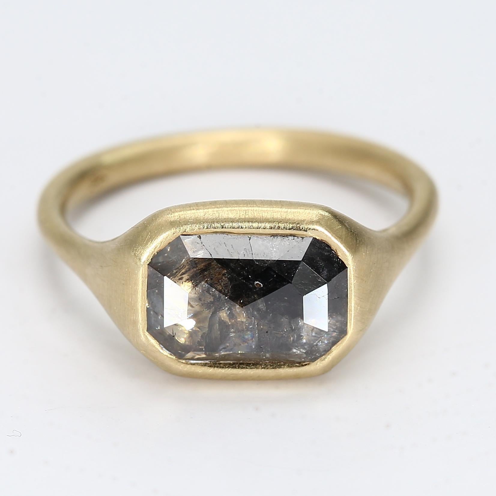 Here is a matte texture 14k Yellow Gold Ring with a 1.5ct bezel-set salt 
pepper diamond in an east/west orientation

1x 1.5ct 7x10mm Salt 
Pepper Diamond
Ring Size - 6.75
Total Weight - 5.54g