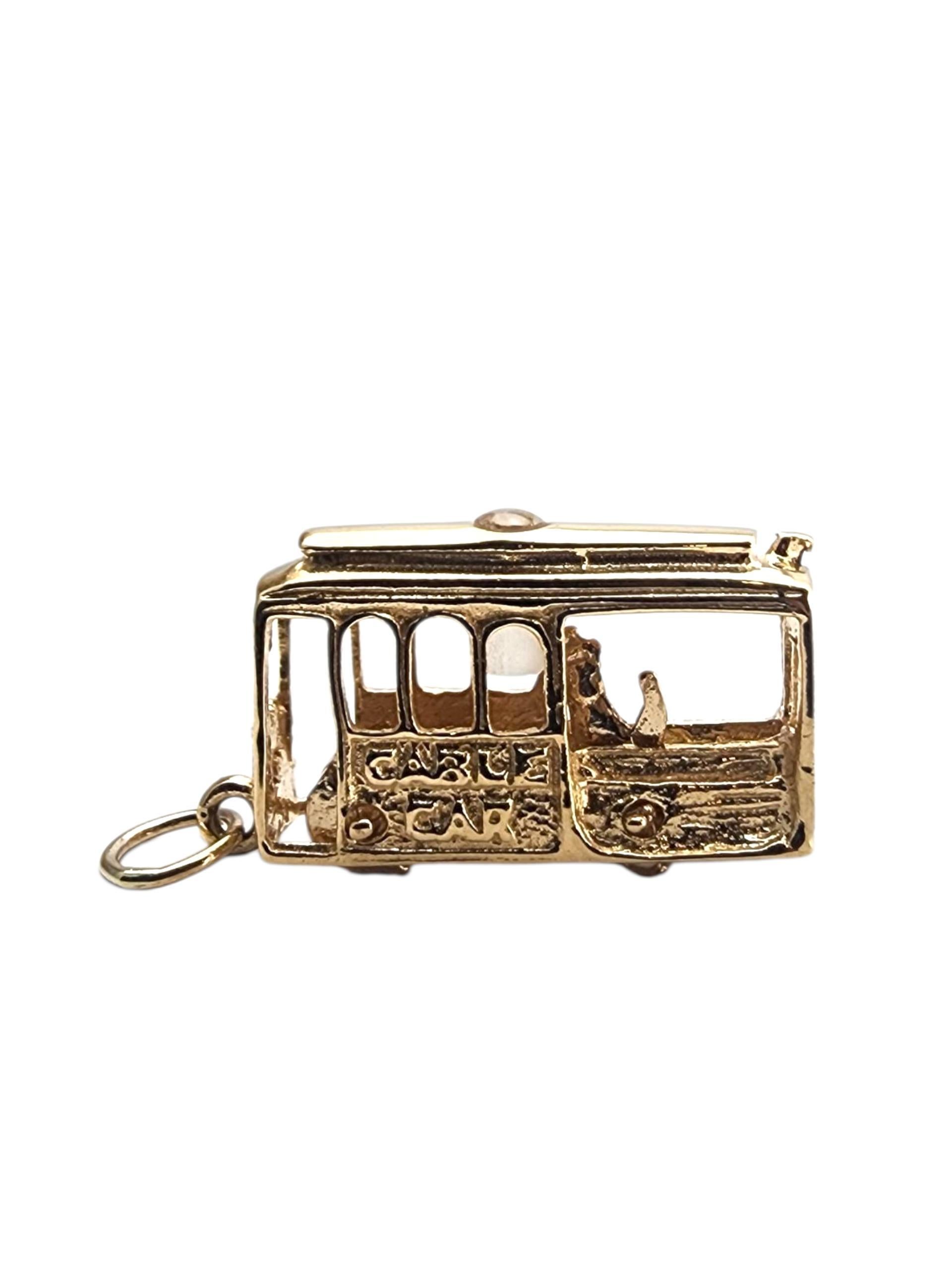 14k Yellow Gold San Francisco Cable Car Charm-

This 14K Yellow Gold Cable Car Charm captures classic charm and adventure in a finely crafted miniature design.

There is a stanhope in this charm, but no photo anymore. 

Size: 22.9 mm x 12.3 mm x 5.6