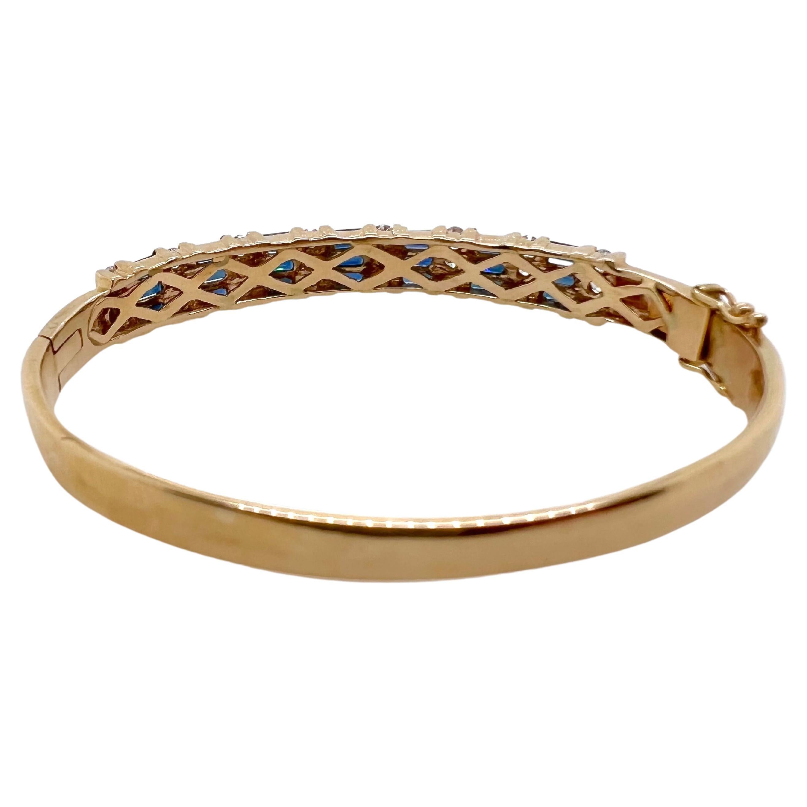 This iconic bangle is made in 14k yellow gold and has sapphire baguettes channeled set along with round diamonds channeled set.  Each section has 3 sapphire baguettes followed by 3 diamonds which makes it symmetrical.  It is perfect for smart casual