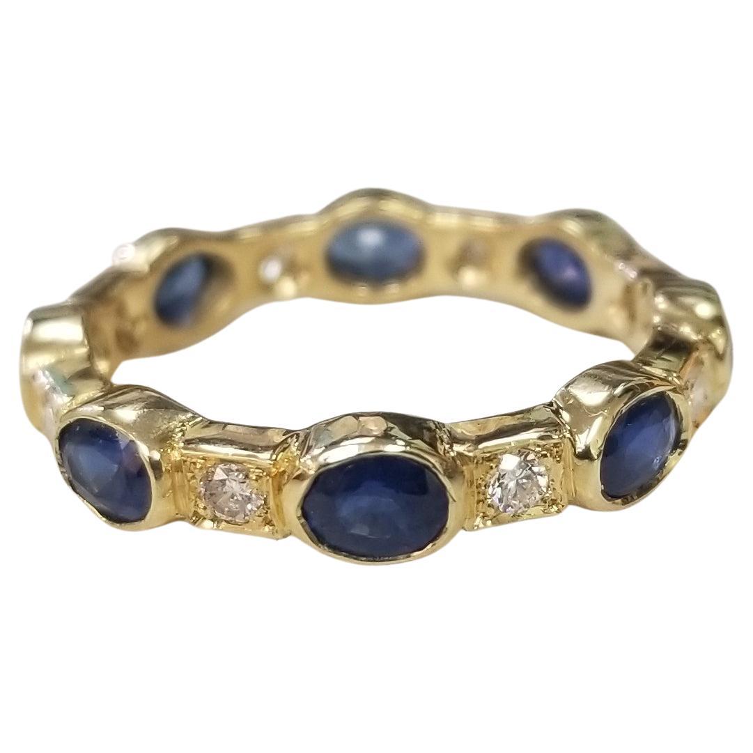 14k Yellow Gold Sapphire and Diamond Bezel Set Eternity Ring For Sale