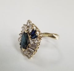 14 Karat Yellow Gold Sapphire and Diamond Cocktail Ring with Marquise Cut Center