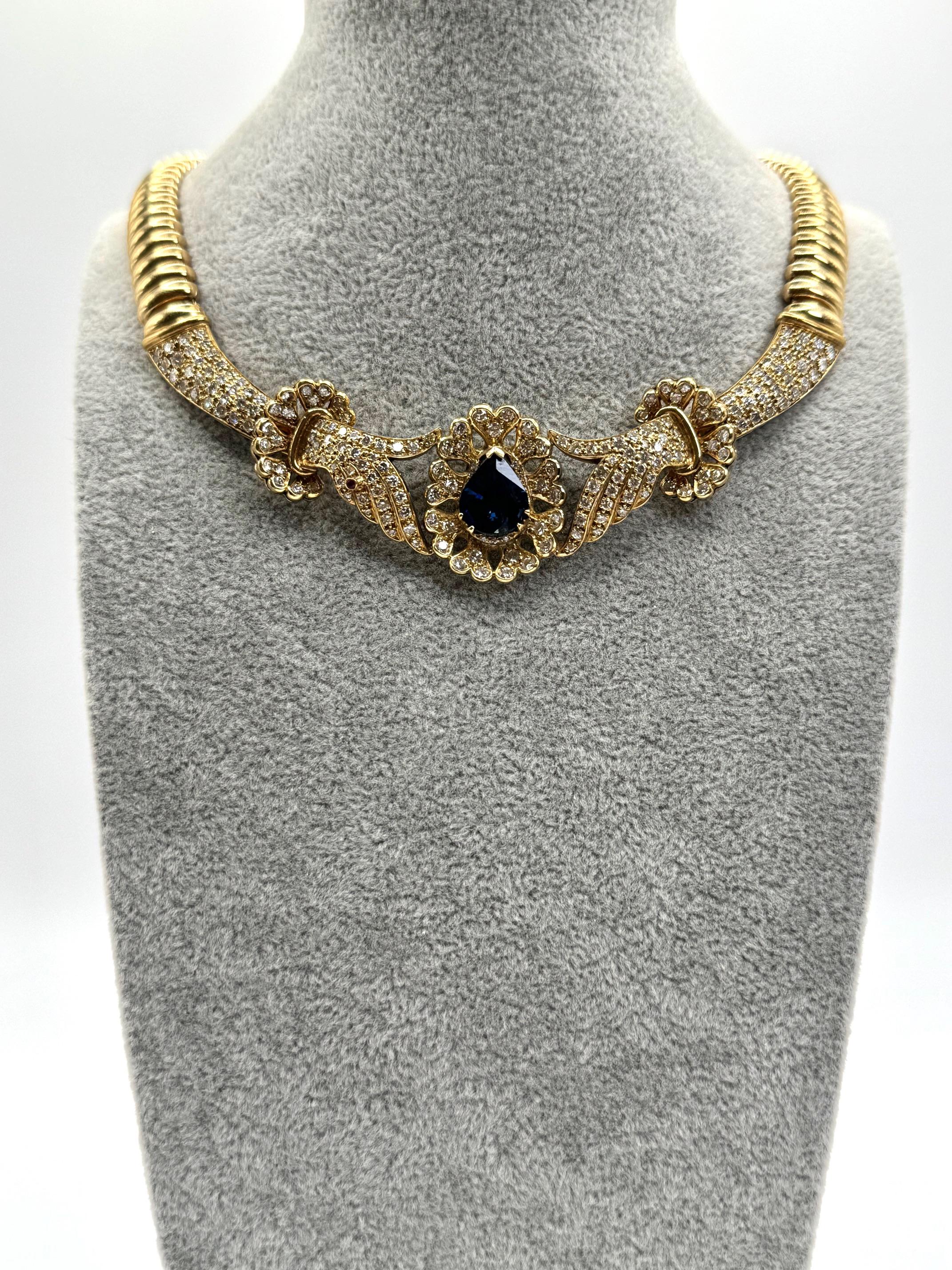 14K Yellow Gold Sapphire and Diamond Necklace. Sapphire pear shape 4.34 carat, brilliants 6.48 carats, and ruby .01 carat