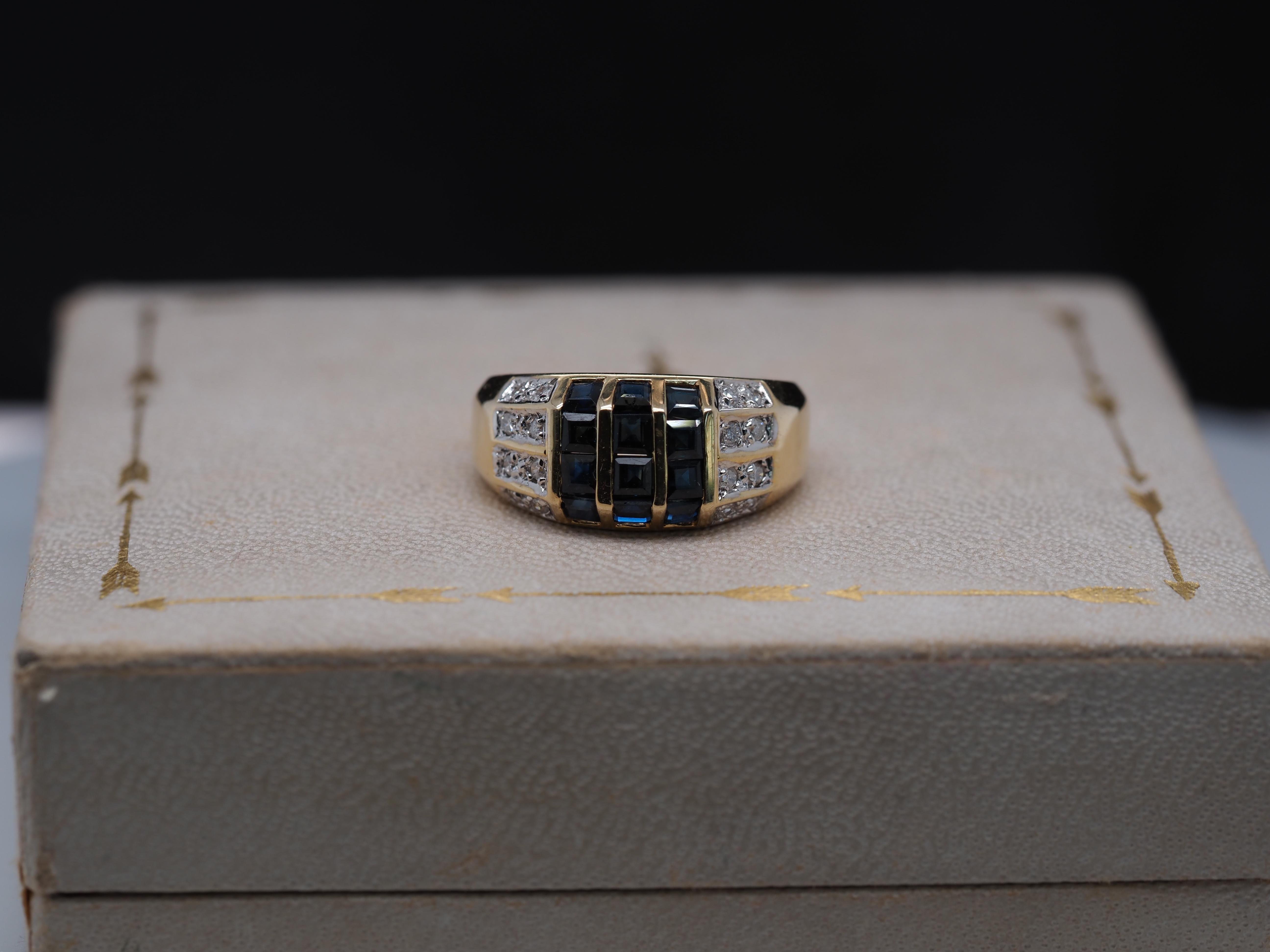 Item Details:
Ring Size: 6.5
Metal Type: 14k Yellow Gold [Hallmarked, and Tested]
Weight: 5.3 grams
‌
Diamond Details:
Weight: .20ct, total weight
Cut: Round Brilliant
Clarity: SI1
Color: G-H
‌
Sapphire Details: Natural, Blue, Square Cut, .60ct