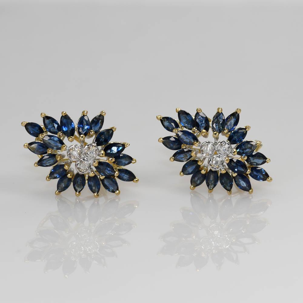 Ladies sapphire and diamond earrings in 14k yellow gold.
Stamped 14k, 585 and weighs 7 grams.
The natural sapphires are marquise shape, 3.00 total carats, nice blue color.
There are some tiny round diamonds in the center of each earring, .03 total