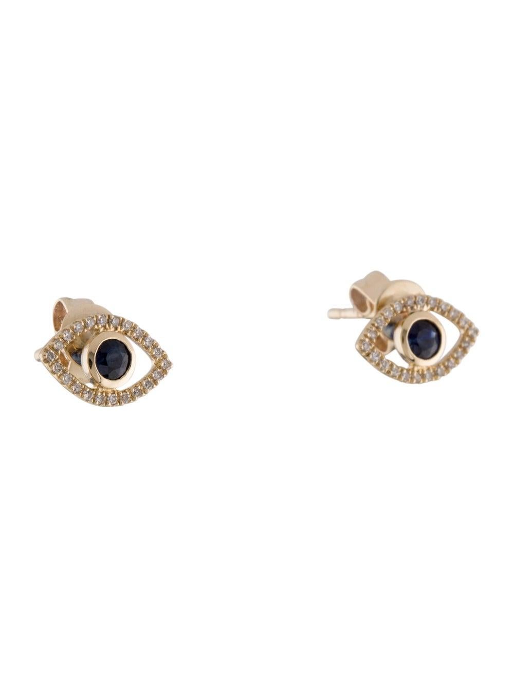  Evil Eye Design Earrings: Made from real 14k gold and round diamonds approximately 0.10 ct. 44 Certified diamonds and 2 Sapphire 0.25 ct. available in white, rose and yellow gold with a color and clarity of GH-SI. 
 Surprise Your Loved Ones with