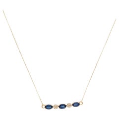 Collana con zaffiro e diamante in oro giallo 14K con zaffiro ovale da 0,73 carati.