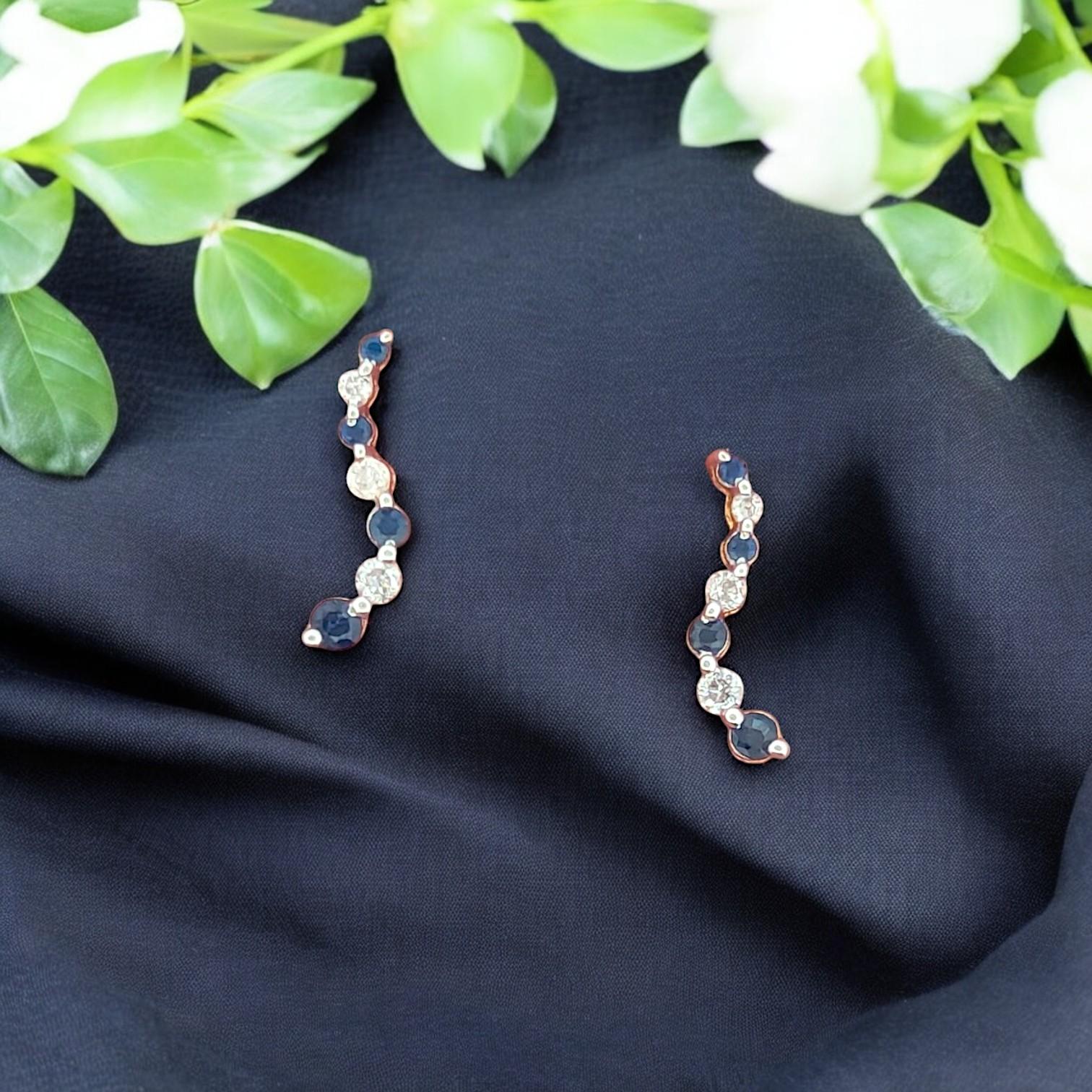 Crafted in 14K yellow gold, these elegant post earrings feature a refined mix of .27 CTW natural Sapphires and Diamonds. Measuring 1/2