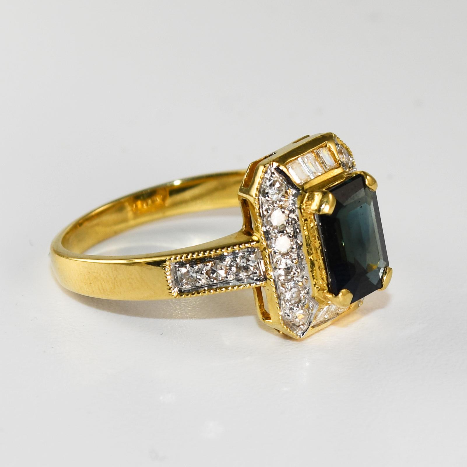 Ladies 18k yellow gold sapphire and Diamond ring.
Stamped 750 and weighs 4.6 grams gross weight.
The natural sapphire is dark blue, 1.50 carats.
On the sides, there are round and baguette diamonds, .25 total carats.
G to H color, Vs clarity.
Ring