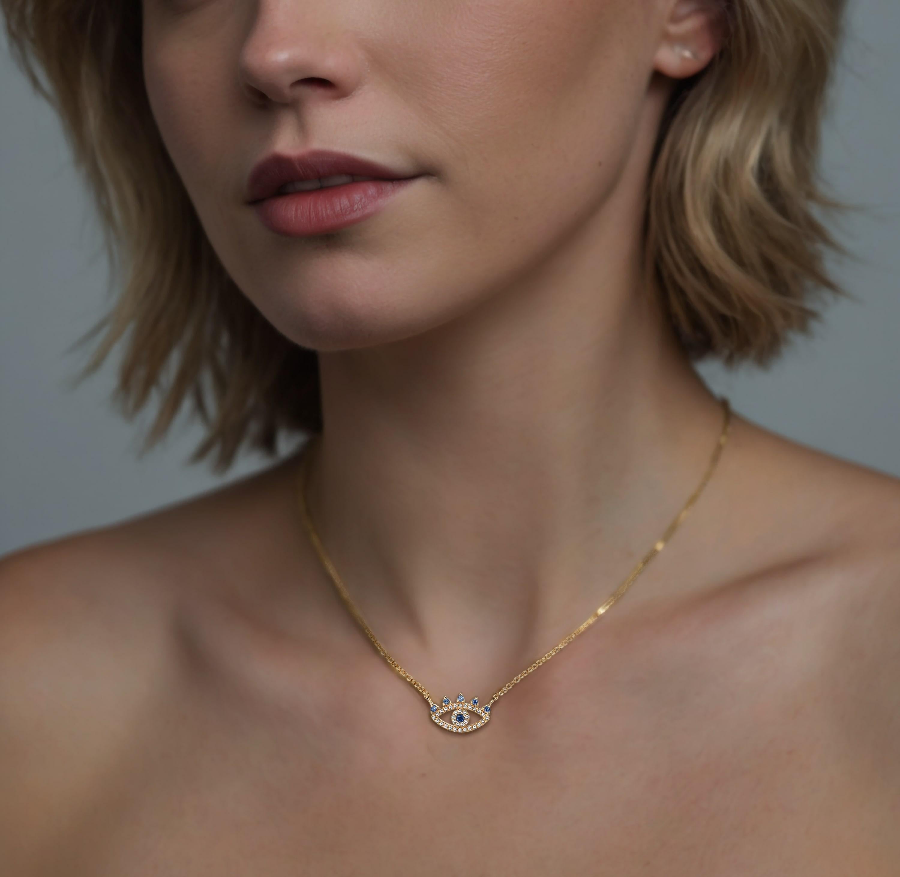 Crafted in radiant 14K yellow gold, this Evil Eye necklace features a stunning sapphire centerpiece that symbolizes protection and style. The deep blue sapphire gemstone forms the eye’s captivating core, beautifully set within a halo of brilliant