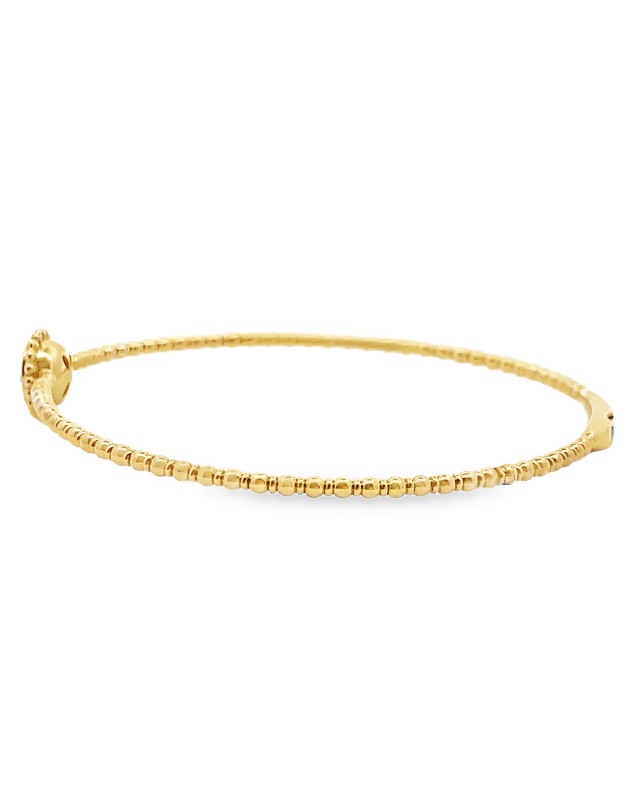 Brazalete de oro amarillo de 14 quilates con diamantes de 0,27 quilates en total.