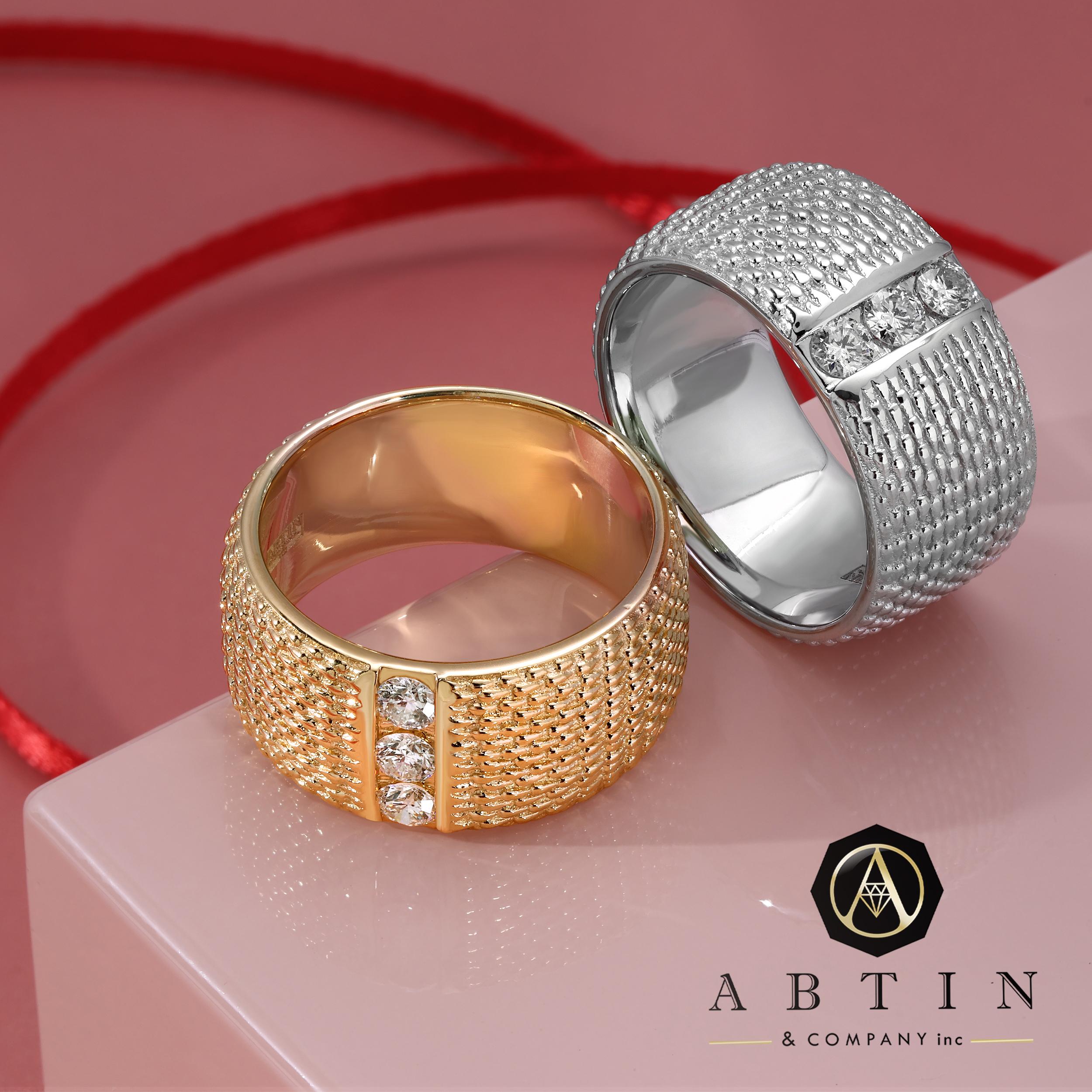 This 14K gold cigar ring showcases an intricate woven design, highlighting a charming rectangular center with three sparkling round diamonds set in 14K gold, totaling 0.31 ct. If you like eye-catching one-of-a-kind jewelry, this ring is for