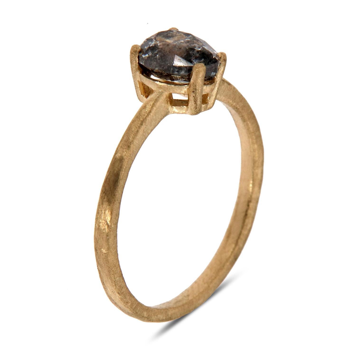 This Earthy design solitaire ring features a 1.12 -Carat Salt & Pepper Pear Shape Natural diamond prong- set on a 1.5 mm matte-finished band. The unique texture that we applied to the band adds to the ring's rustic appeal. Experience the difference