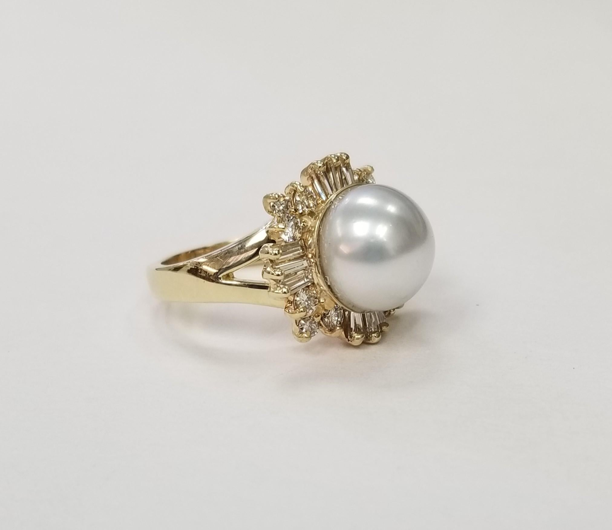 Gorgeous 14k yellow gold South Sea Pearl and Diamonds Ring.
*Motivated to Sell - Please make a Fair Offer*
Specifications:
    main stone: 11.50 mm South Sea Pearl
    diamonds: 24 round and baguette cut
    carat total weight: .70 CTW
    color: G
