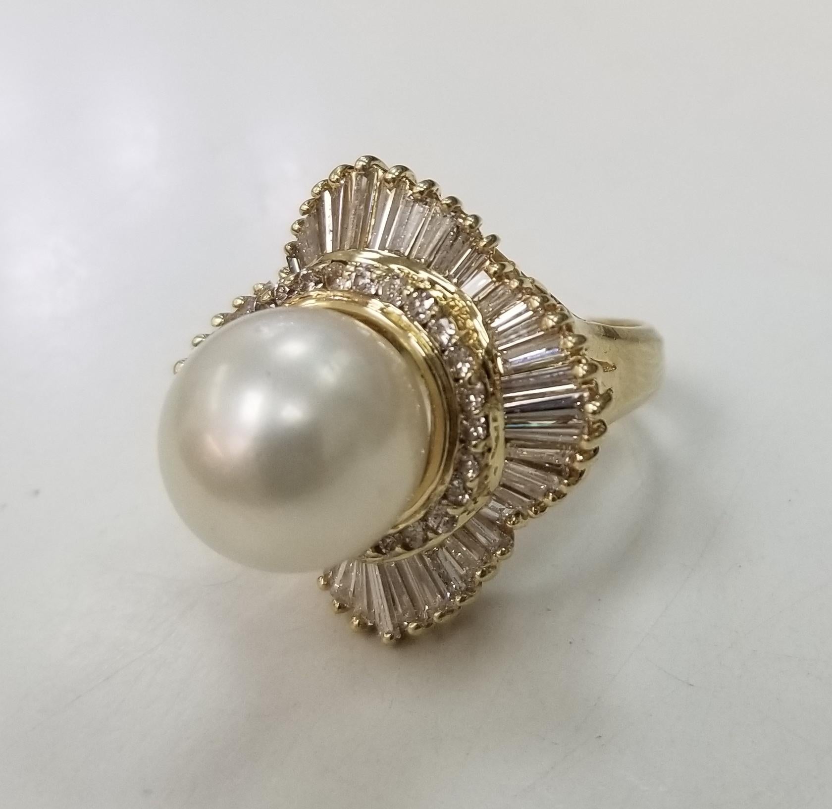 Gorgeous 14k yellow gold south sea pearl with diamonds baguette ballerina.
Specifications:
    main stone: 12mm White South Sea Pearl
    diamonds: 50 baguette PIECES
    carat total weight: APPROX 2.50 CTW
    color: G
    clarity: VS1
    diamond:
