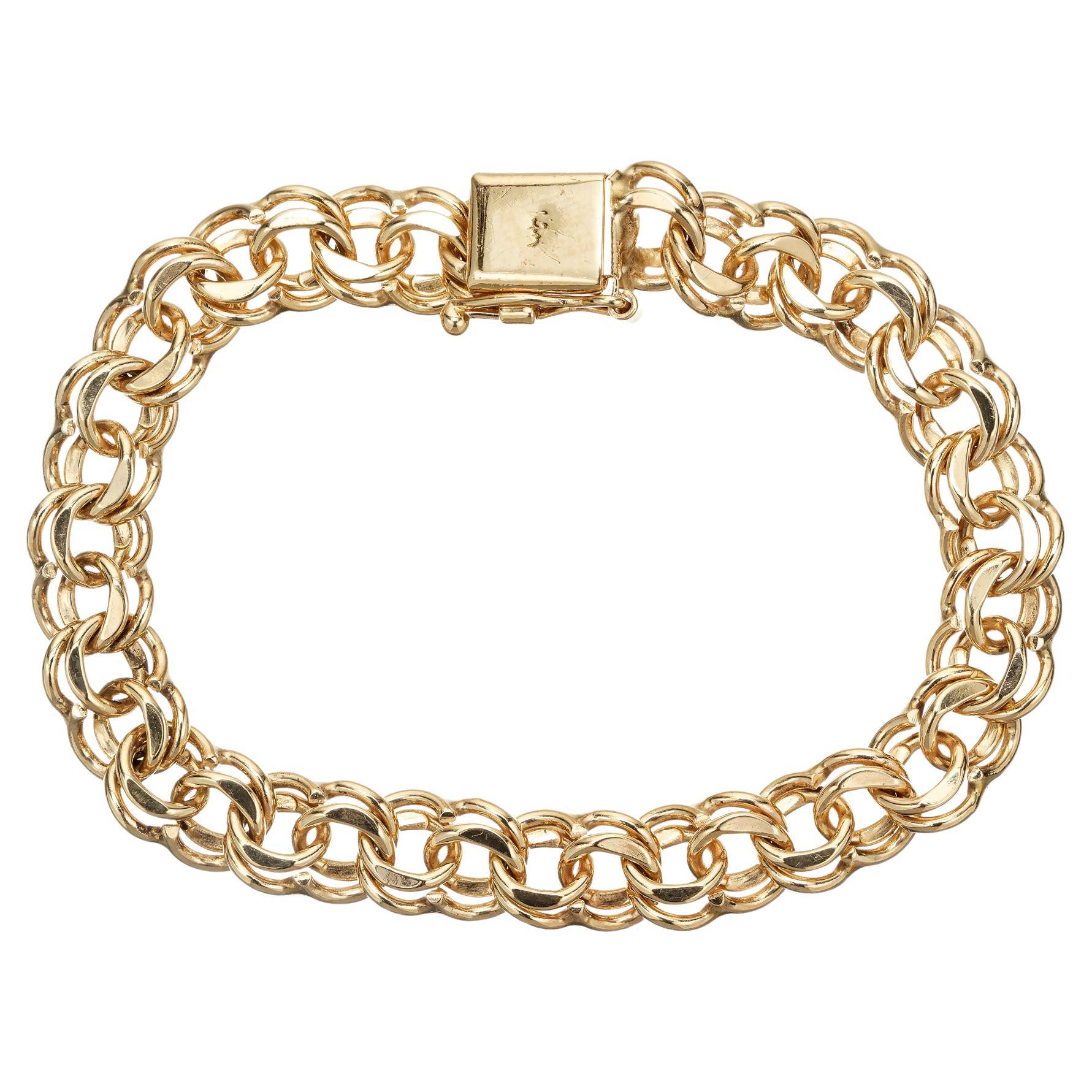 Classic mid-century 1960's 14k yellow gold 9mm wide double link construction, making it a perfect accessory for both casual and formal occasions. With its sturdy clasp, at 7.75 inches in length, this bracelet ensures a secure and comfortable fit on