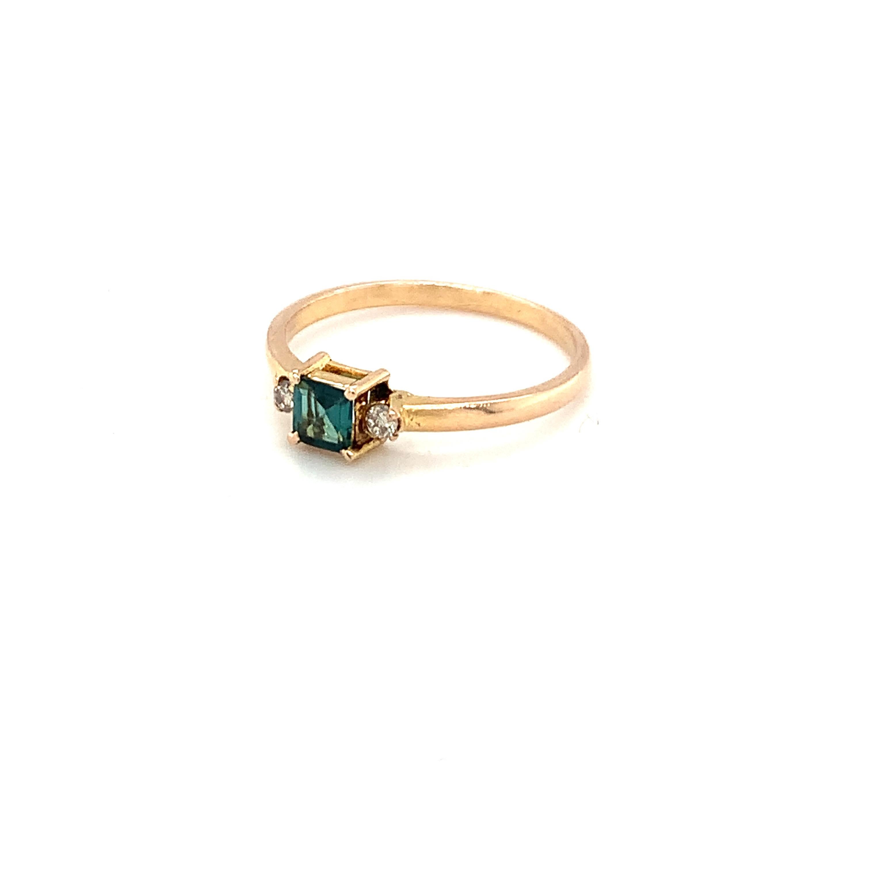 Hand cut and polished tiny natural green tourmaline ring is crafted with hand in 14K yellow gold with two accent diamonds on each side.
Ideal for casual daily wear.
Image is enlarged to get a closer view.
Ethically sourced natural gem stone.