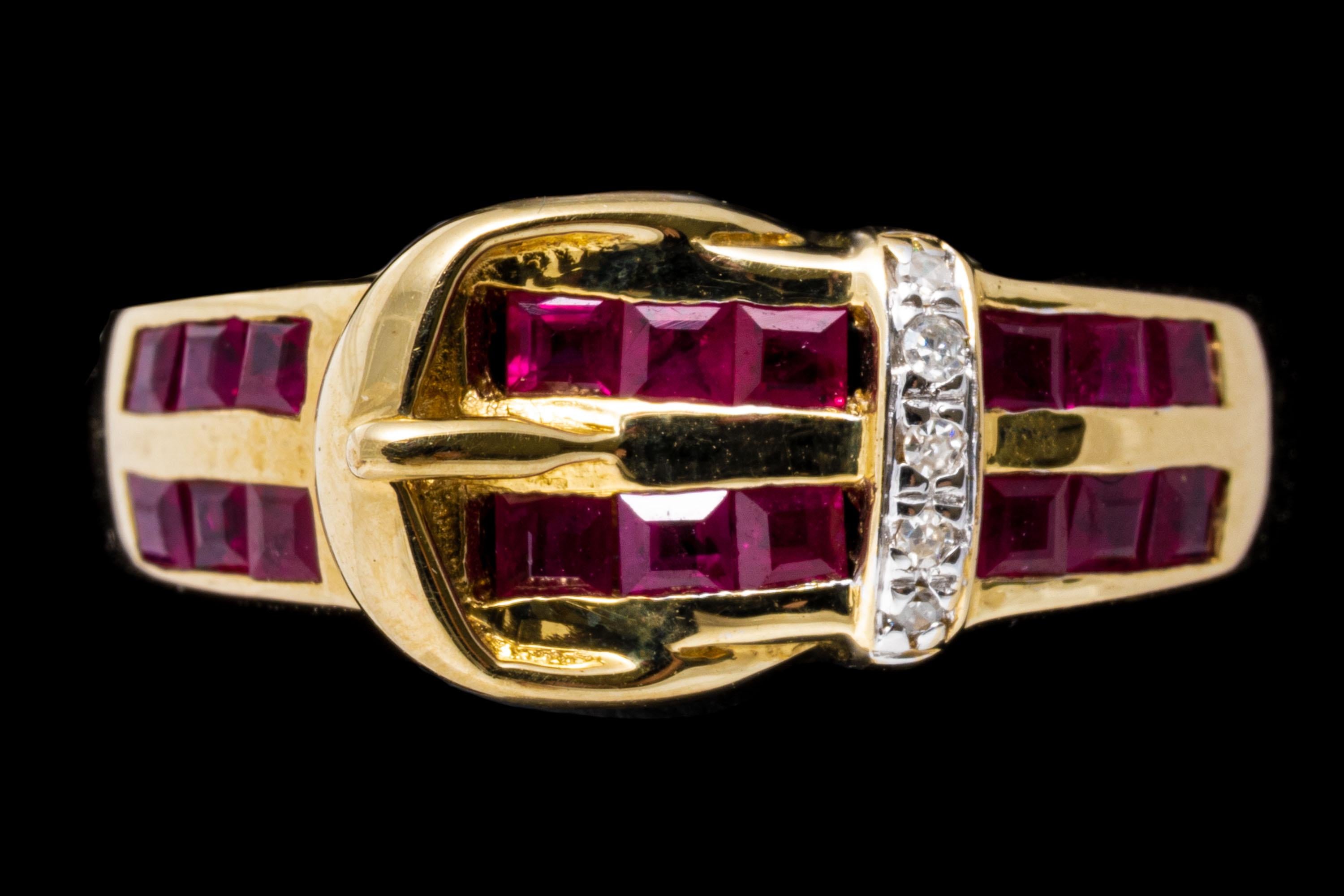 14k yellow gold ring. This handsome ring is a buckle style, set with two rows of square faceted, pinkish red rubies, approximately 0.72 TCW, channel set, and decorated with a gold buckle motif and a belt loop decorated with round faceted diamonds,