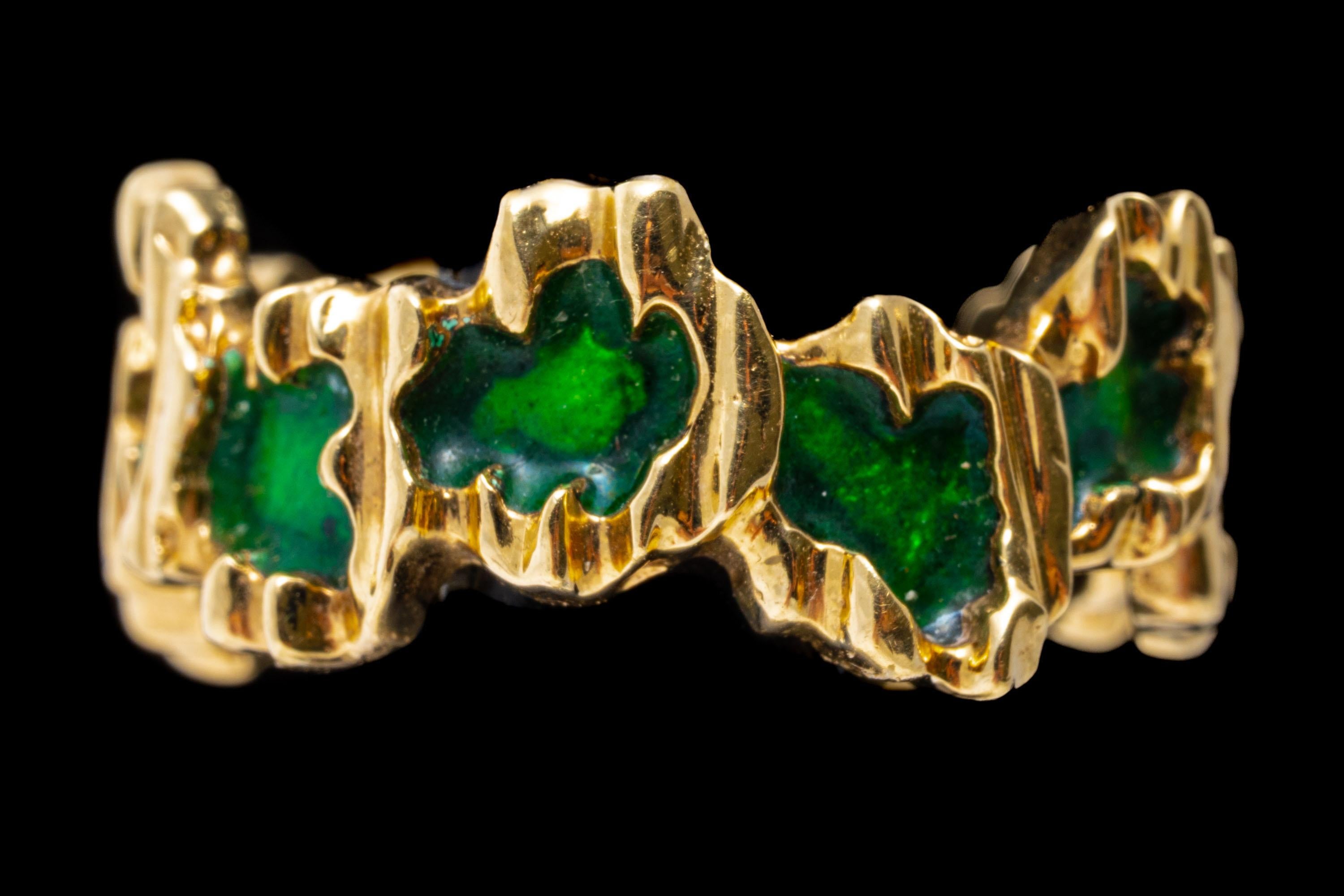 14k yellow gold ring. This unique, striking wide band ring is decorated throughout with a staggered pattern of  bright green color enamel, trimmed in yellow gold.
Marks: None, tests 14k
Dimensions: 1/4