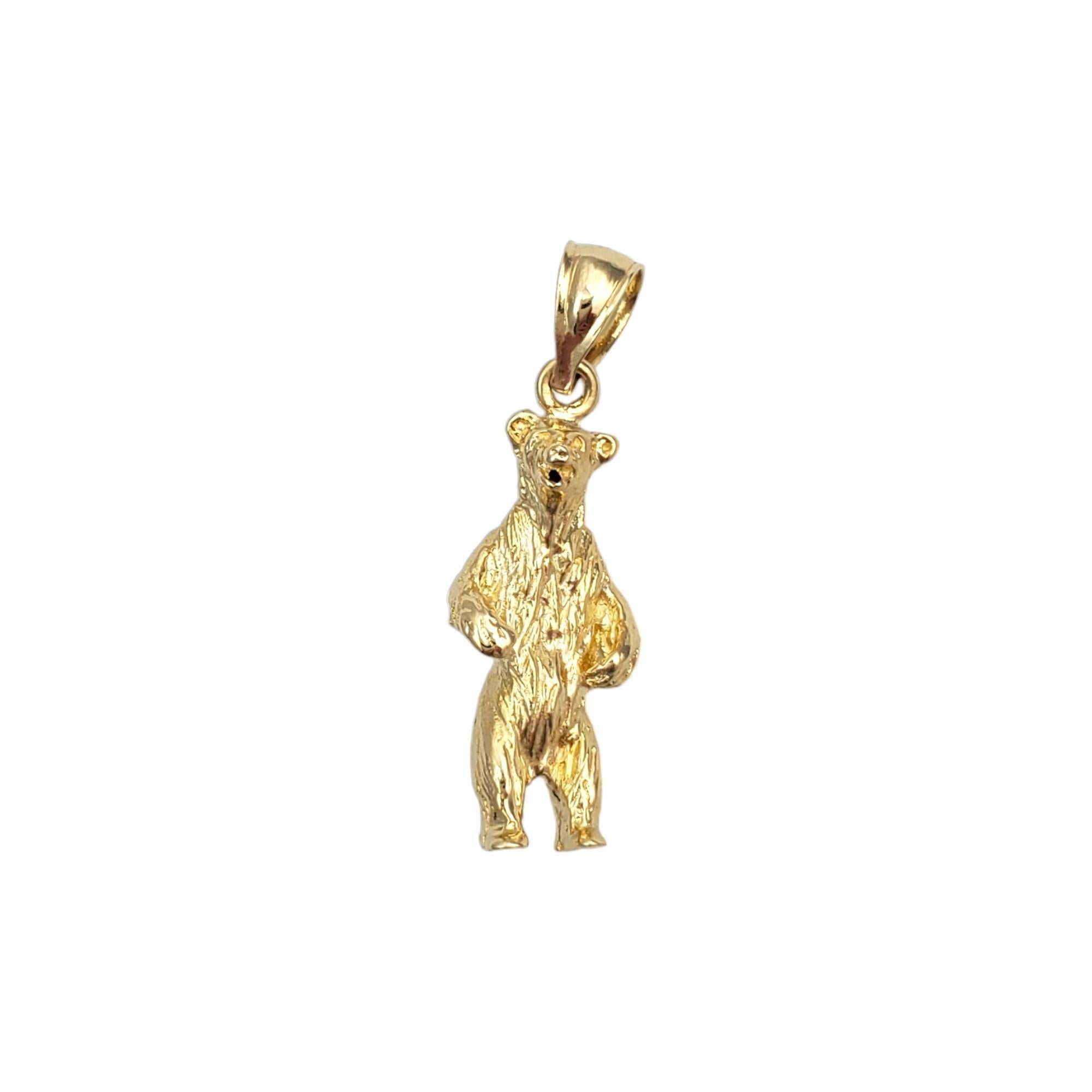 Vintage 14 karat yellow gold Bear charm -

This miniature bear charm captures the essence of strength and wilderness, and is beautifully crafted in 14K yellow gold.

Size: 20.58mm x 8.8mm

Stamped: 14K D2

Weight: 3.58 gr./ 2.30 dwt.

Chain not