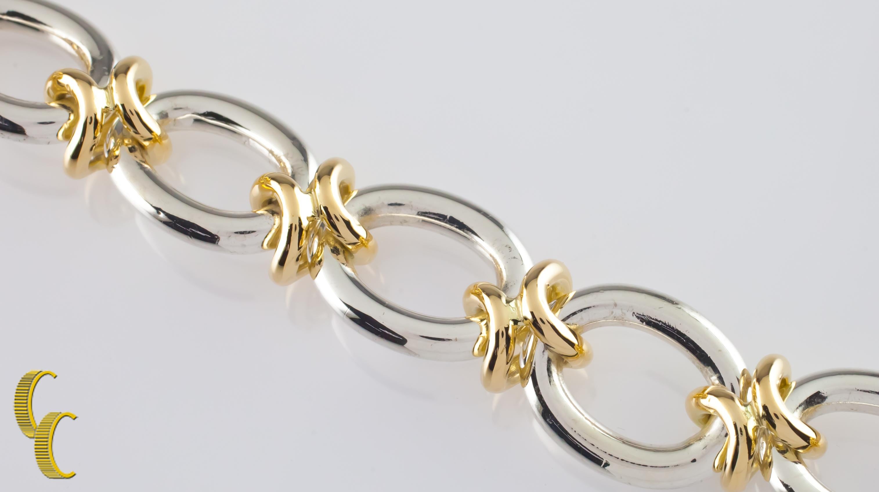 Gorgeous Sterling Silver and 14k Yellow Gold Link Bracelet
Features Large Oval Sterling Silver Links connected by 14k Yellow Gold H-Shaped Links
Silver Links are Approximately 20 mm Long x 16 mm Wide
Made in Italy
Total Length = 7.5