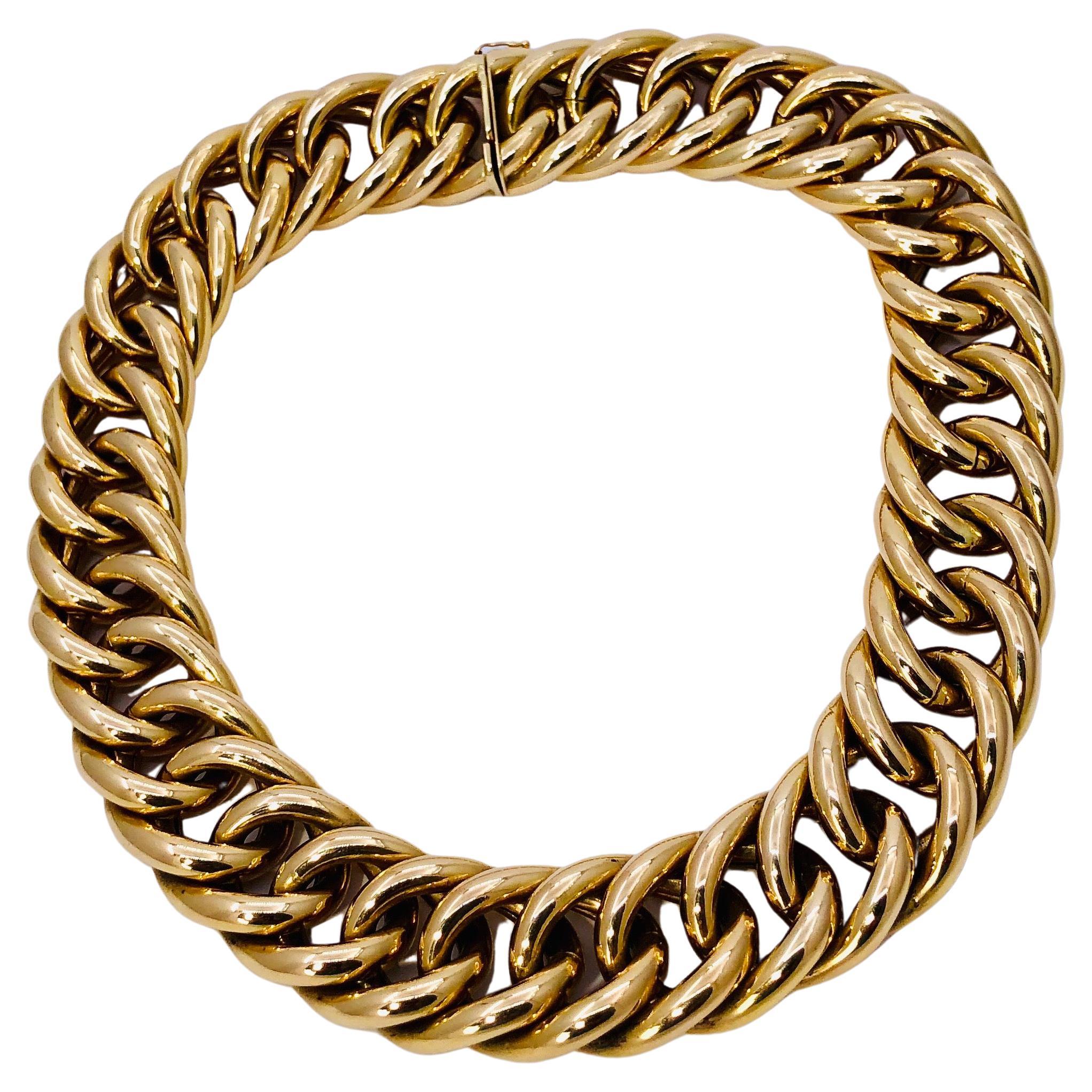 Constructed from 14k yellow gold, this excellent vintage condition, Italian made necklace measures a full 1 inch in width by 17 inches in length. It lays beautifully on the neck and makes a very powerful statement. This is a true 