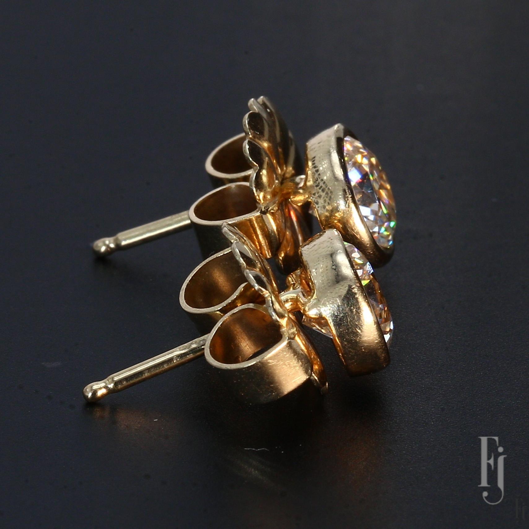 Here are 14k Yellow Gold Stud Earrings with one ~1.0ct. G/SI2 Round White Diamond in each stud.

Total Weight - 2.5g