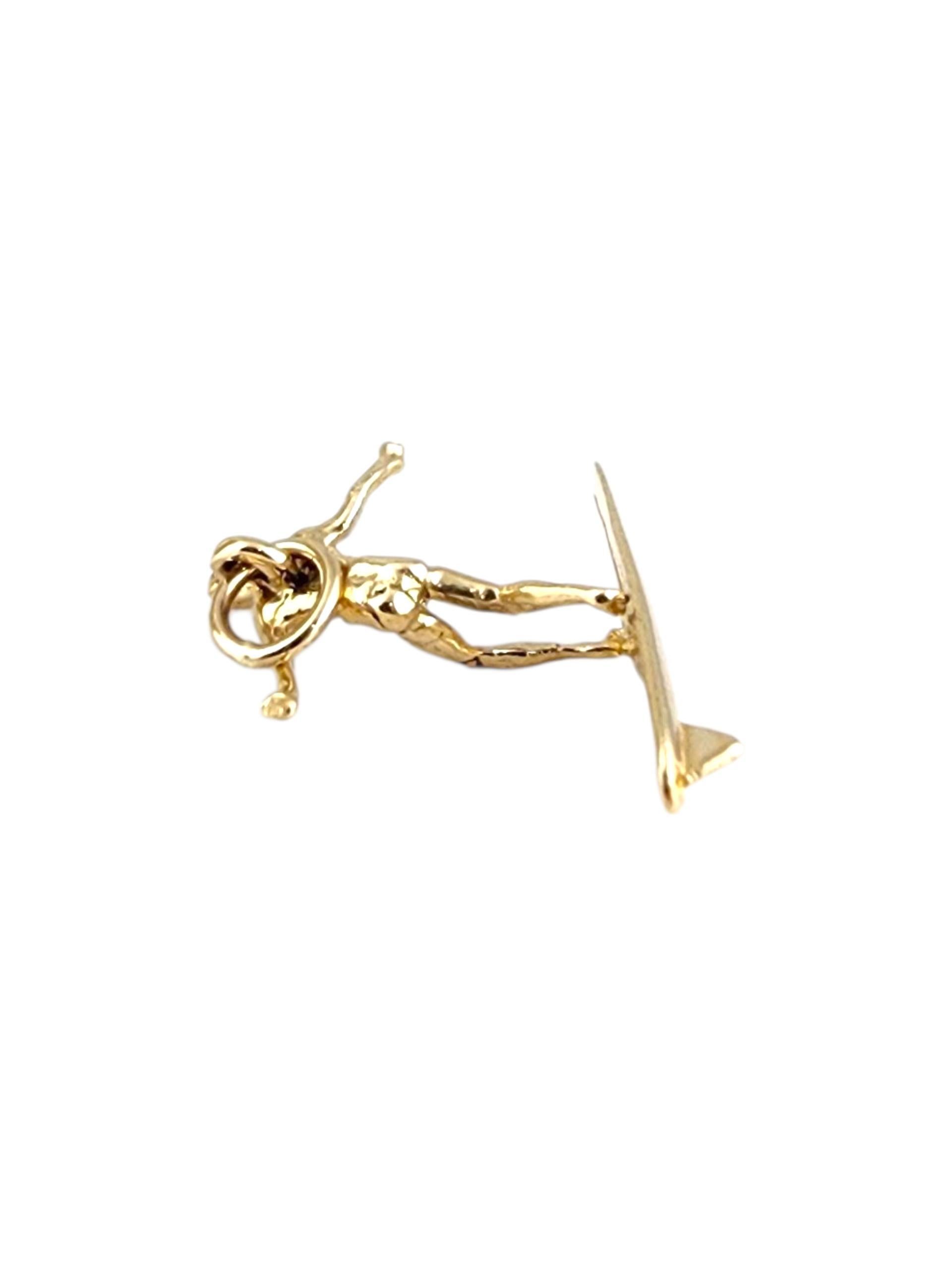 14K Yellow Gold Surfer Charm -

This 14K yellow gold surfer charm captures the thrill and freedom of riding the waves. Expertly crafted with fine details and a polished finish, it’s a perfect tribute to beach life and adventurous spirit. A stylish