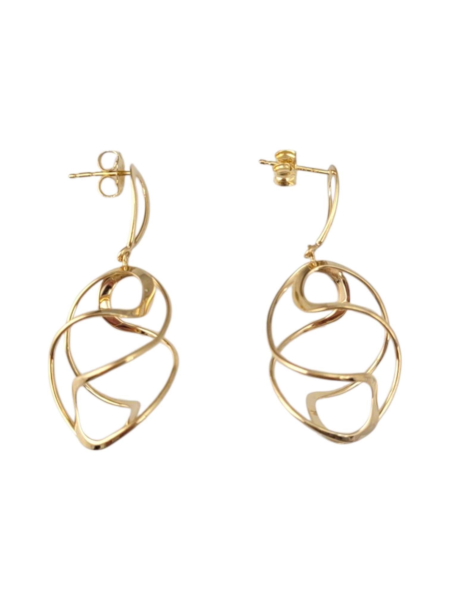 14K Yellow Gold Swirl Dangle Earrings -

These 14K yellow gold dangle earrings showcase a graceful, elongated design that moves beautifully with every step. Crafted in radiant gold, they add a touch of sophistication and glamour—perfect for both