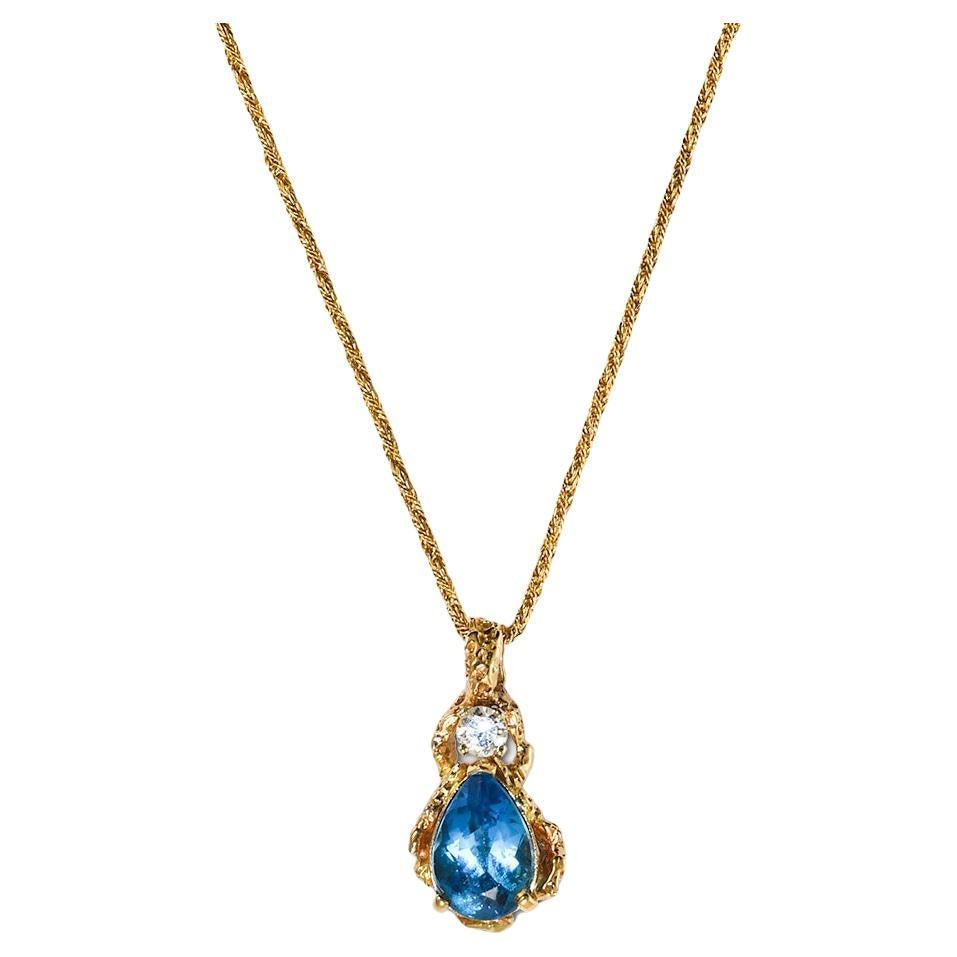 Collier en or jaune 14 carats, topaze bleue suisse et diamants 0,33 carat en vente