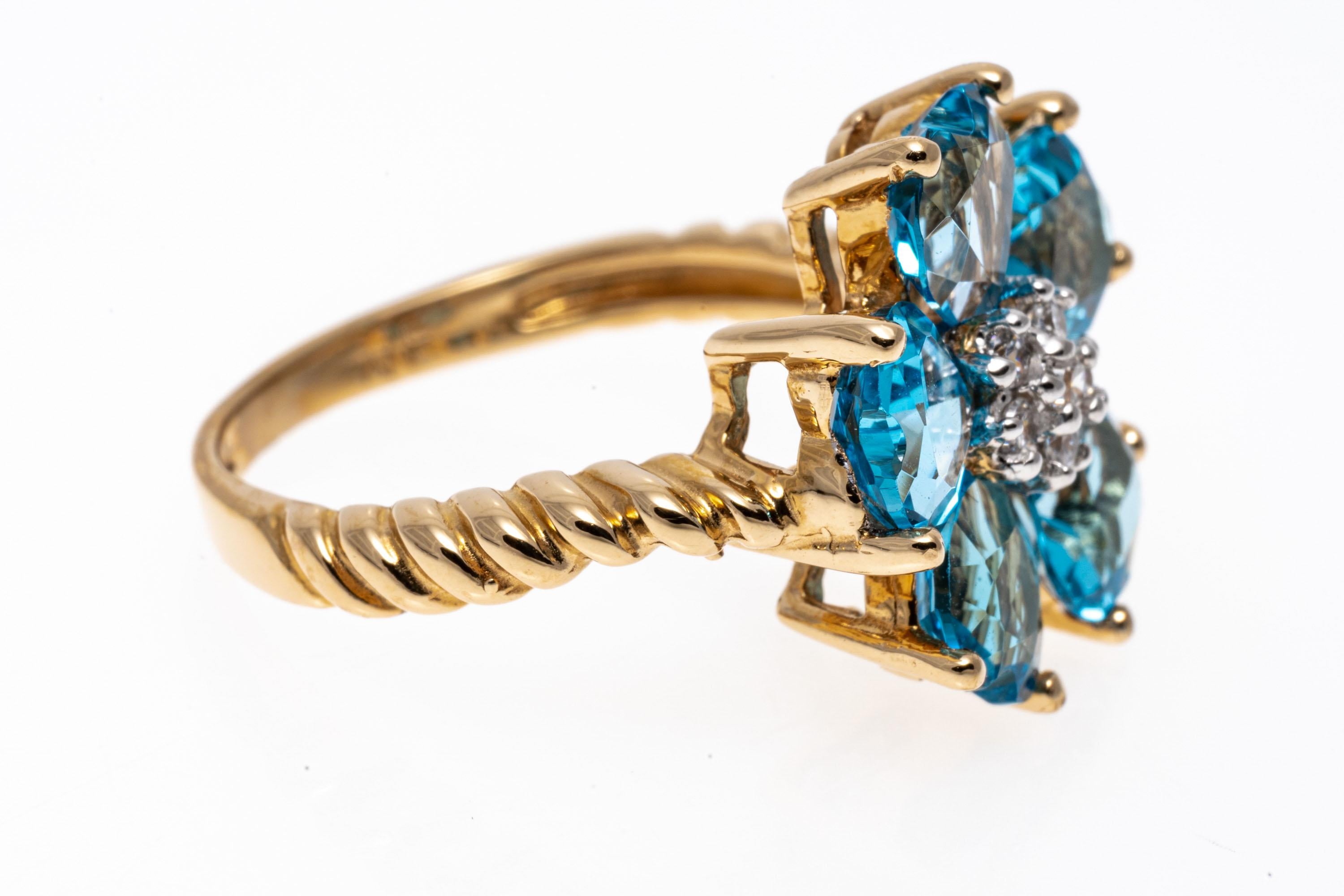 Contemporary 14k Yellow Gold Swiss Blue Topaz Flower Form Ring For Sale