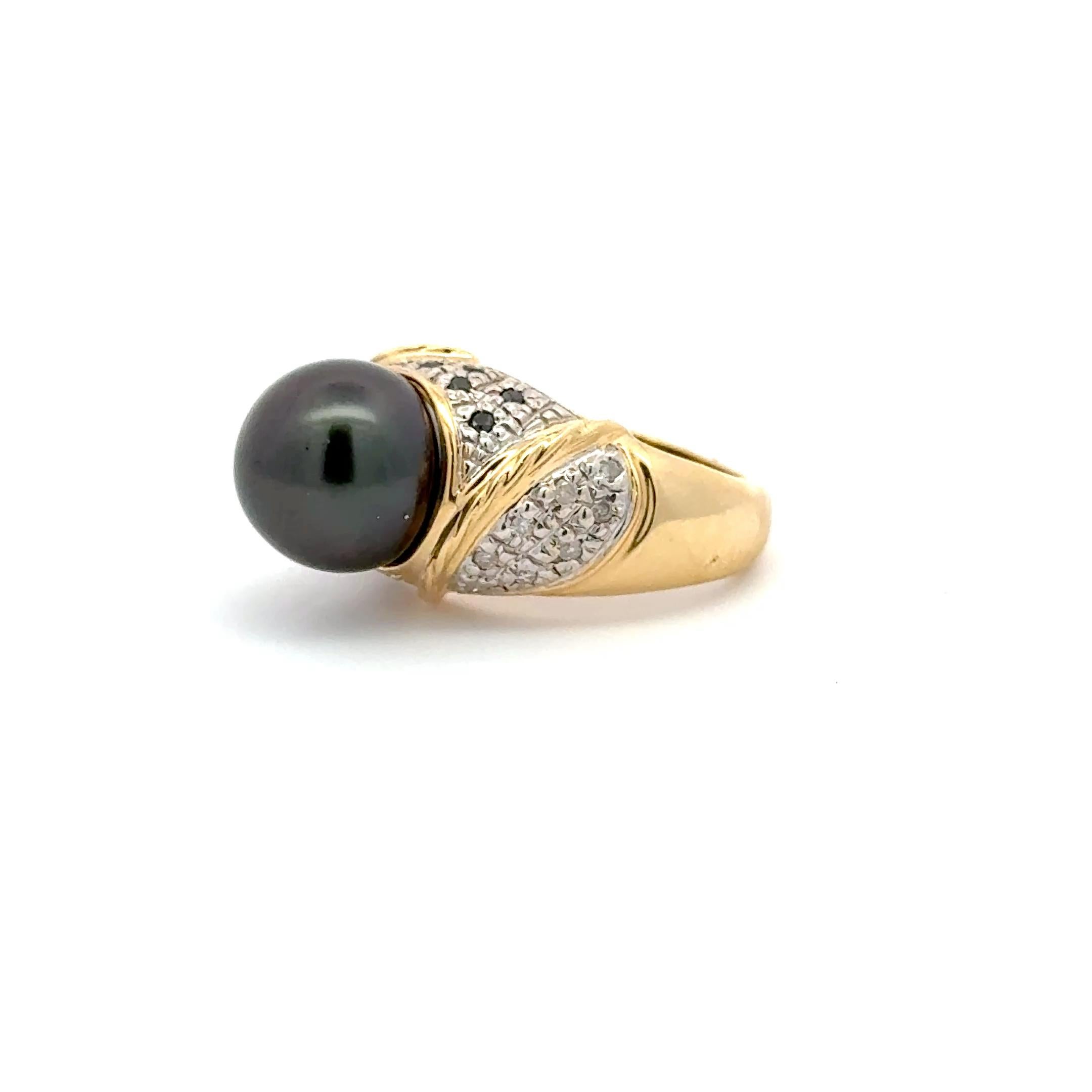 Exude timeless sophistication with this luxurious 14K yellow gold statement ring, showcasing a lustrous 10.70mm natural Tahitian pearl. With its deep, captivating hue and exceptional luster, the pearl sits gracefully at the center of a bold,