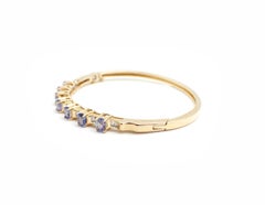 14 Karat Yellow Gold, Tanzanite and Baguette Diamond Bangle Bracelet