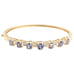 14 Karat Yellow Gold, Tanzanite and Baguette Diamond Bangle Bracelet