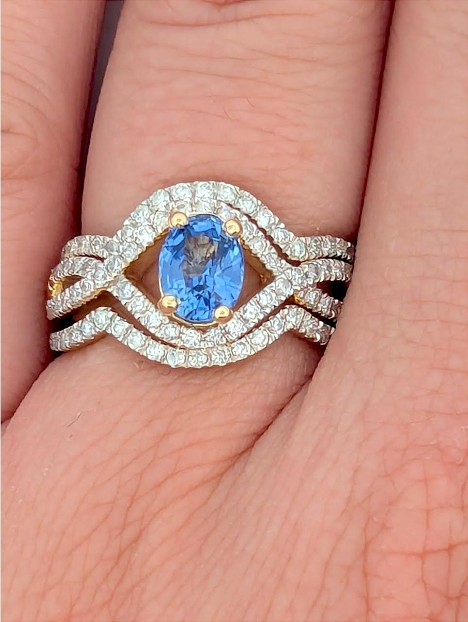 This breathtaking 14K yellow gold wedding set features a striking .70 CT oval-cut Tanzanite, beautifully complemented by .70 CTW natural round diamonds. Designed with matching contour bands, this set offers a seamless, elegant fit, making it a