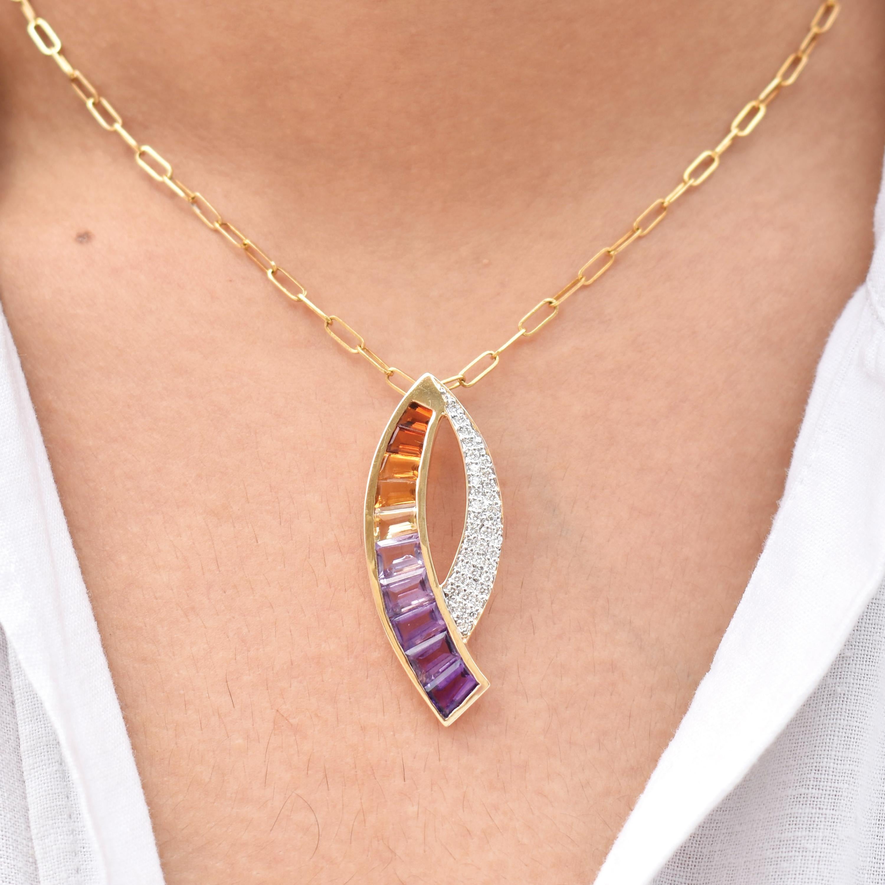 Crafted in radiant 14K yellow gold, this contemporary curve pendant beautifully captures the essence of color, movement, and masterful craftsmanship. Shaped in an elegant wave that naturally contours the neckline, it offers a refined yet