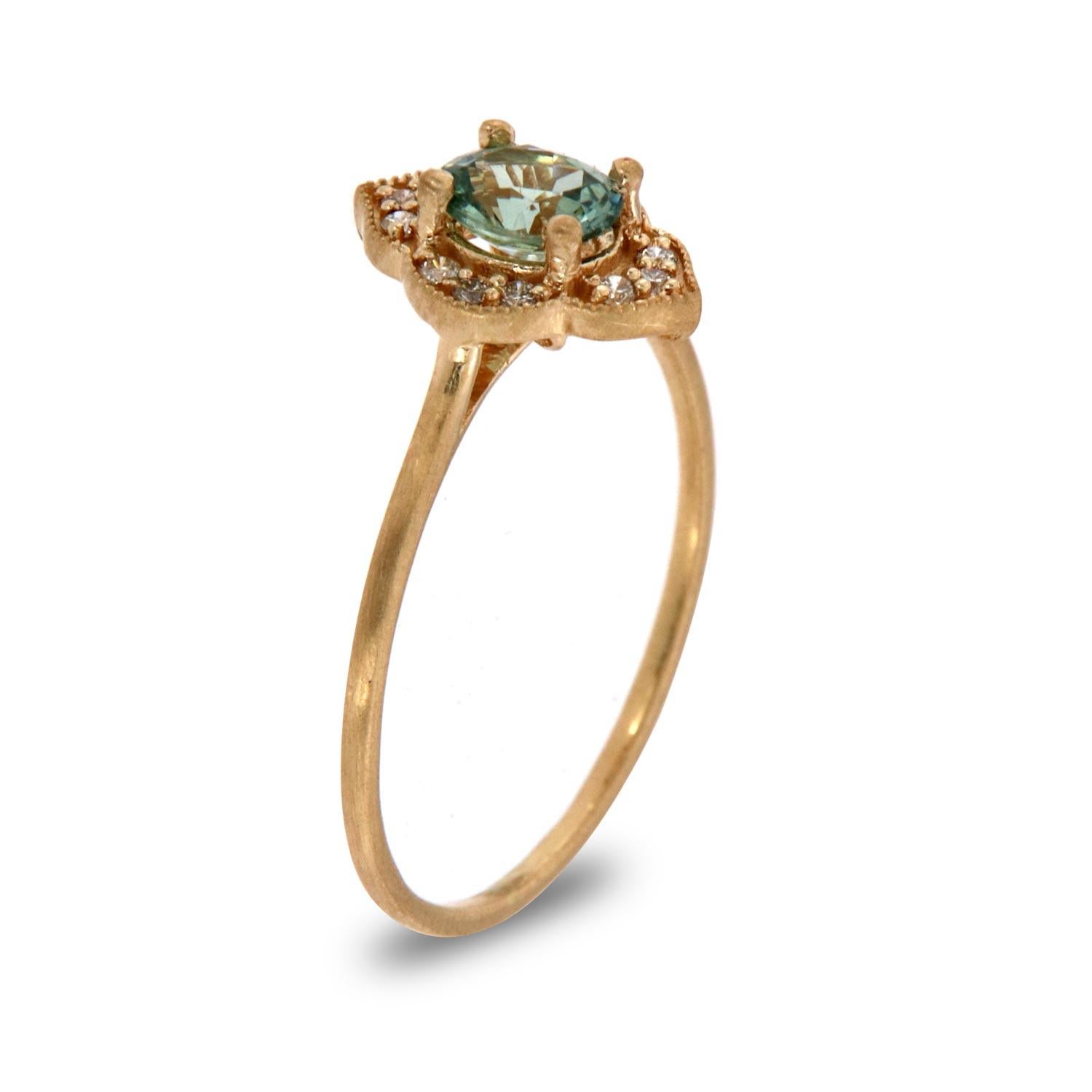 This petite rustic halo ring is impressive in its vintage appeal, featuring a natural teal oval sapphire, accented with milgrain and a round brilliant diamonds. Experience the difference in person!

Product details: 

Center Gemstone Type: