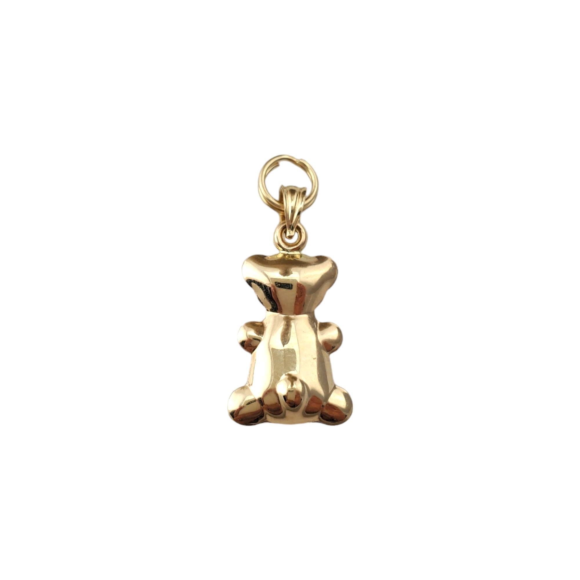 14K Yellow Gold Teddy Bear Charm 

Adorable teddy bear charm with buttons in 14K yellow gold.

Hallmark: 14K GCJ

Weight: 0.83 dwt / 1.29 g

Length w/ bail: 29.55 mm

Size: 20.45 mm X 12.29 mm X 4.77 mm

Very good condition, professionally