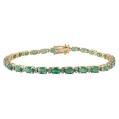 14k Yellow Gold Tennis Bracelet Featuring 6.01 Carat Emerald with Diamonds